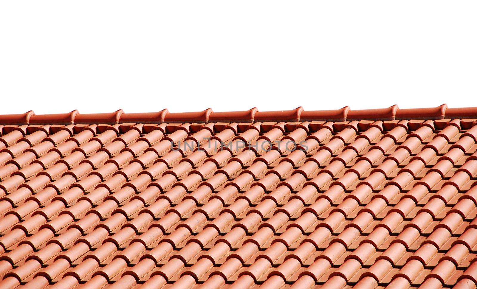 orange tiles on the roof of a house (isolated on white background)