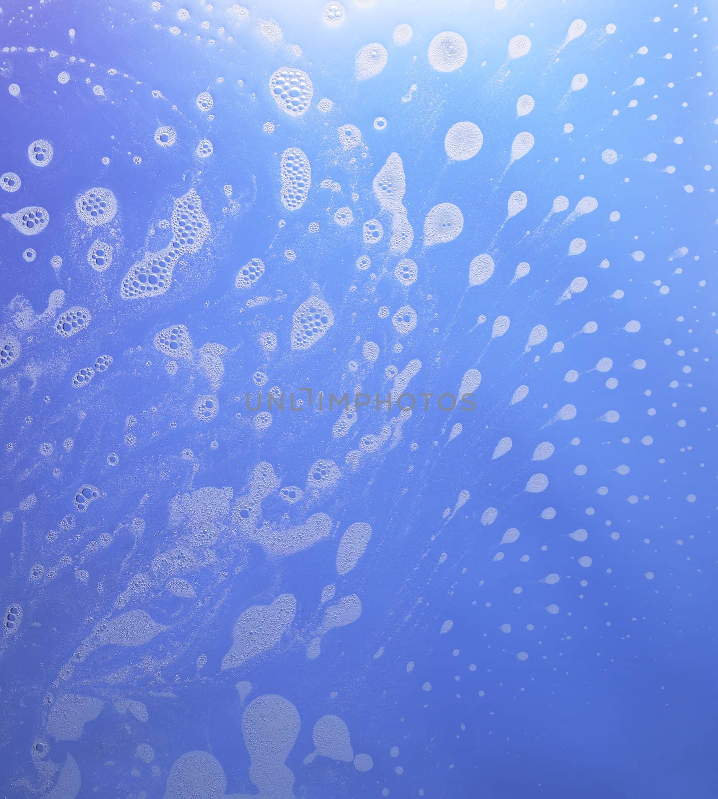 abstract wet blue background with soap bubble conglomerations