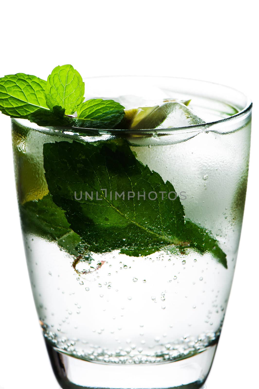 Closeup of soda water with limes and mint on White background