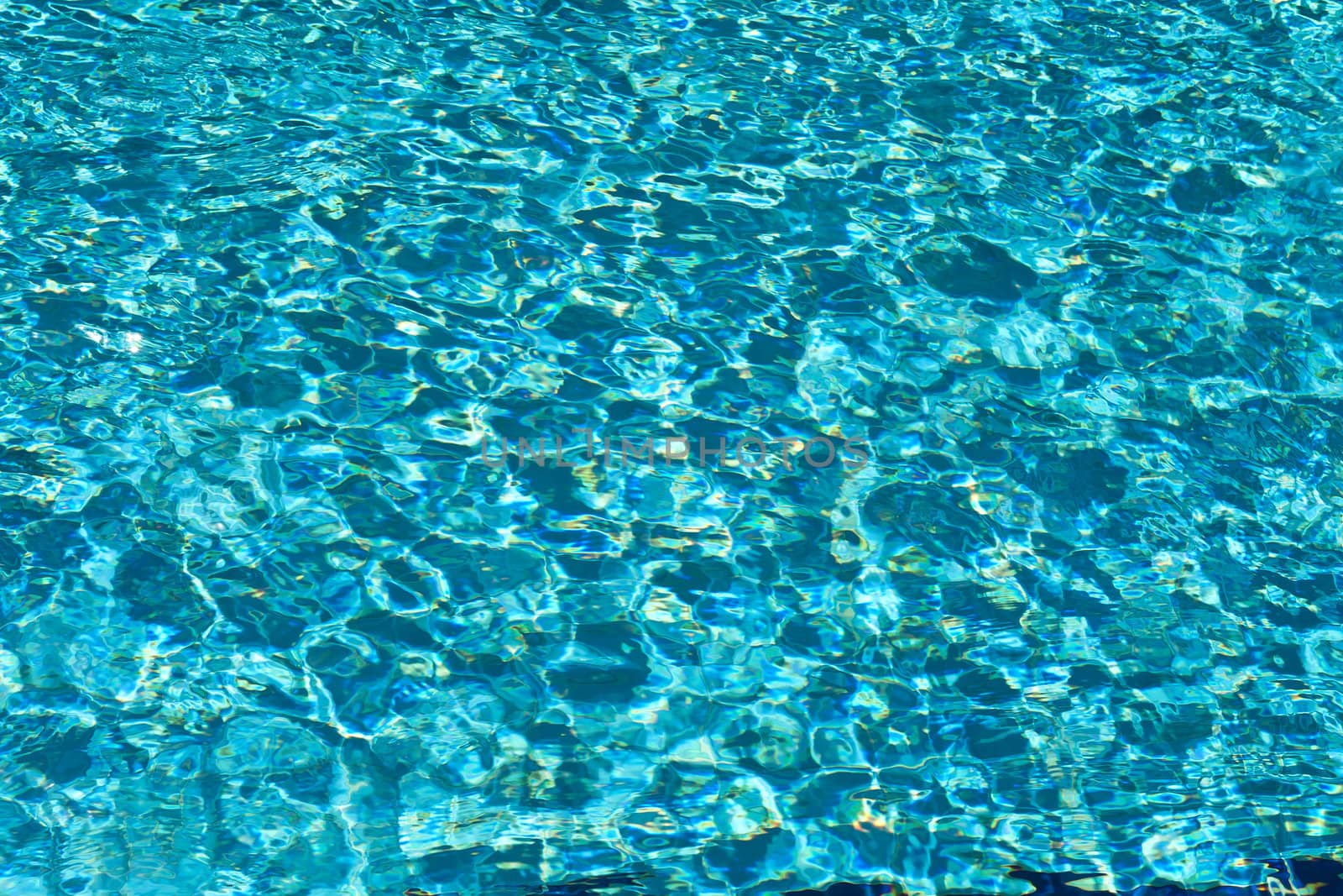 Rippled pattern of water in a swimming pool by Ronyzmbow