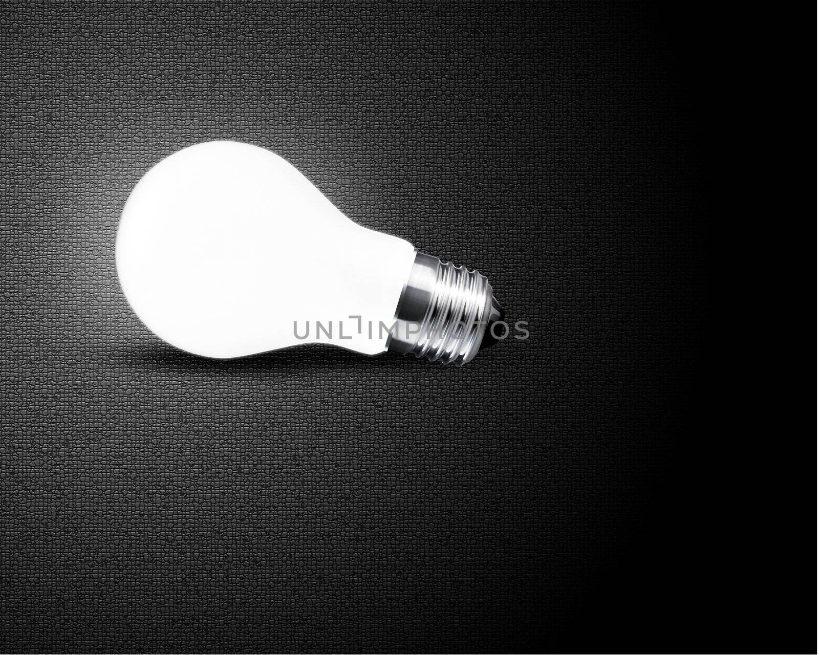 one glowing Light bulb on black background
