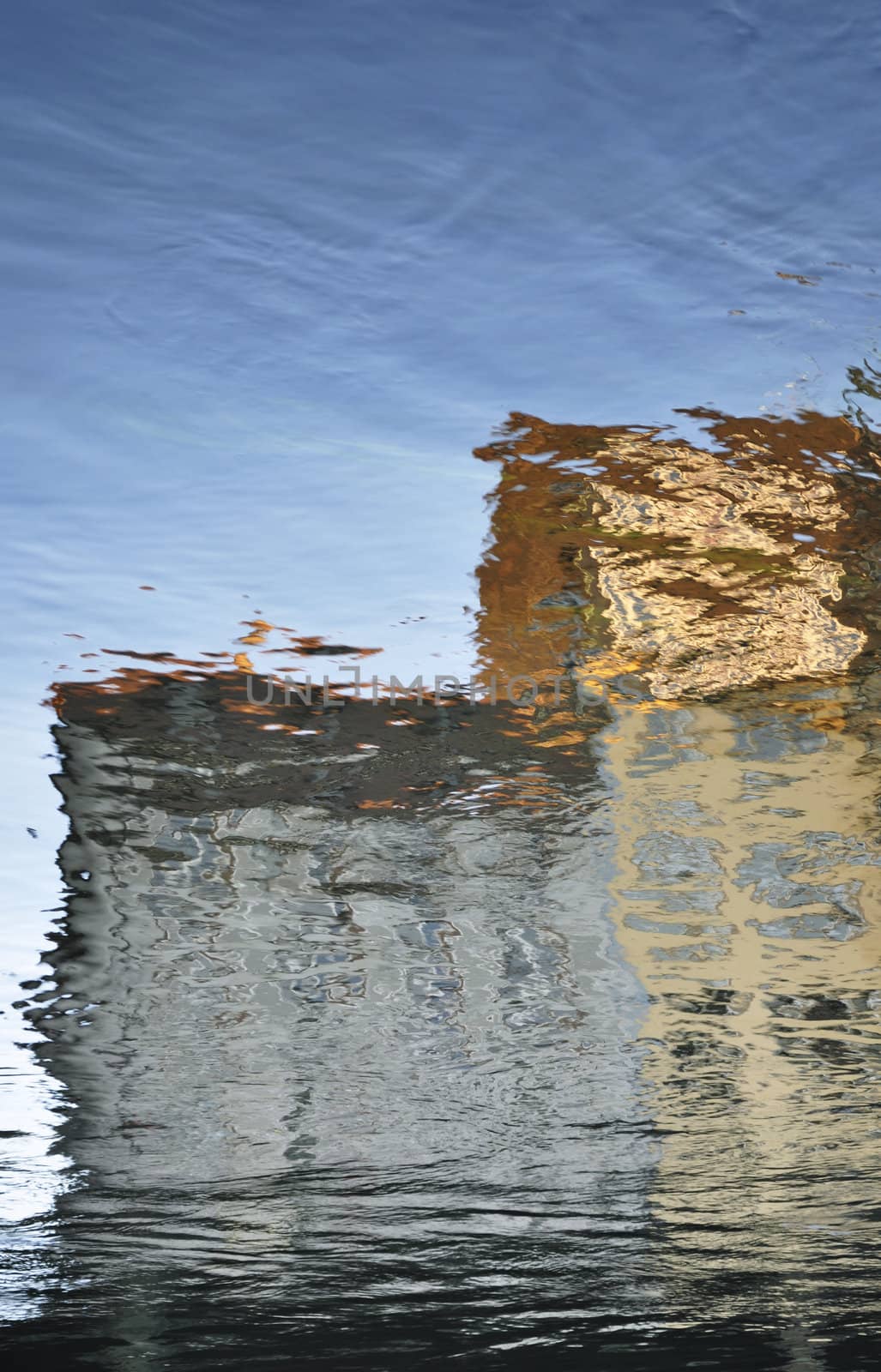 The Reflection Of An Old Building In The Water
