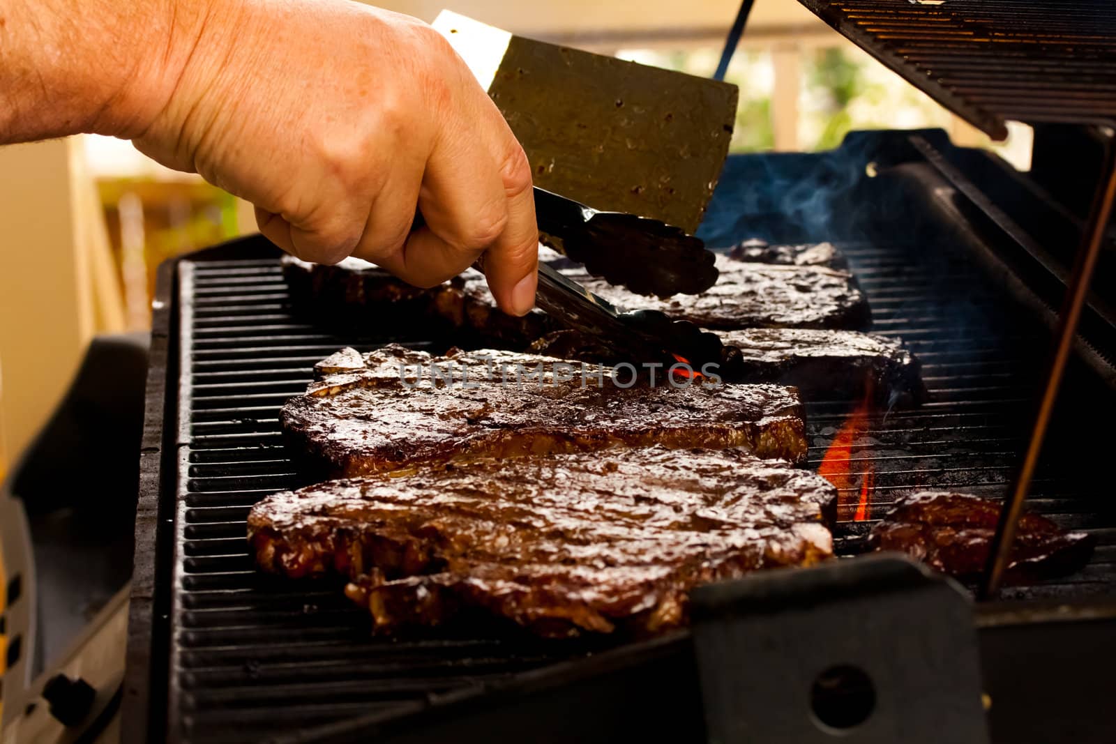 delicious steaks on the barbeque