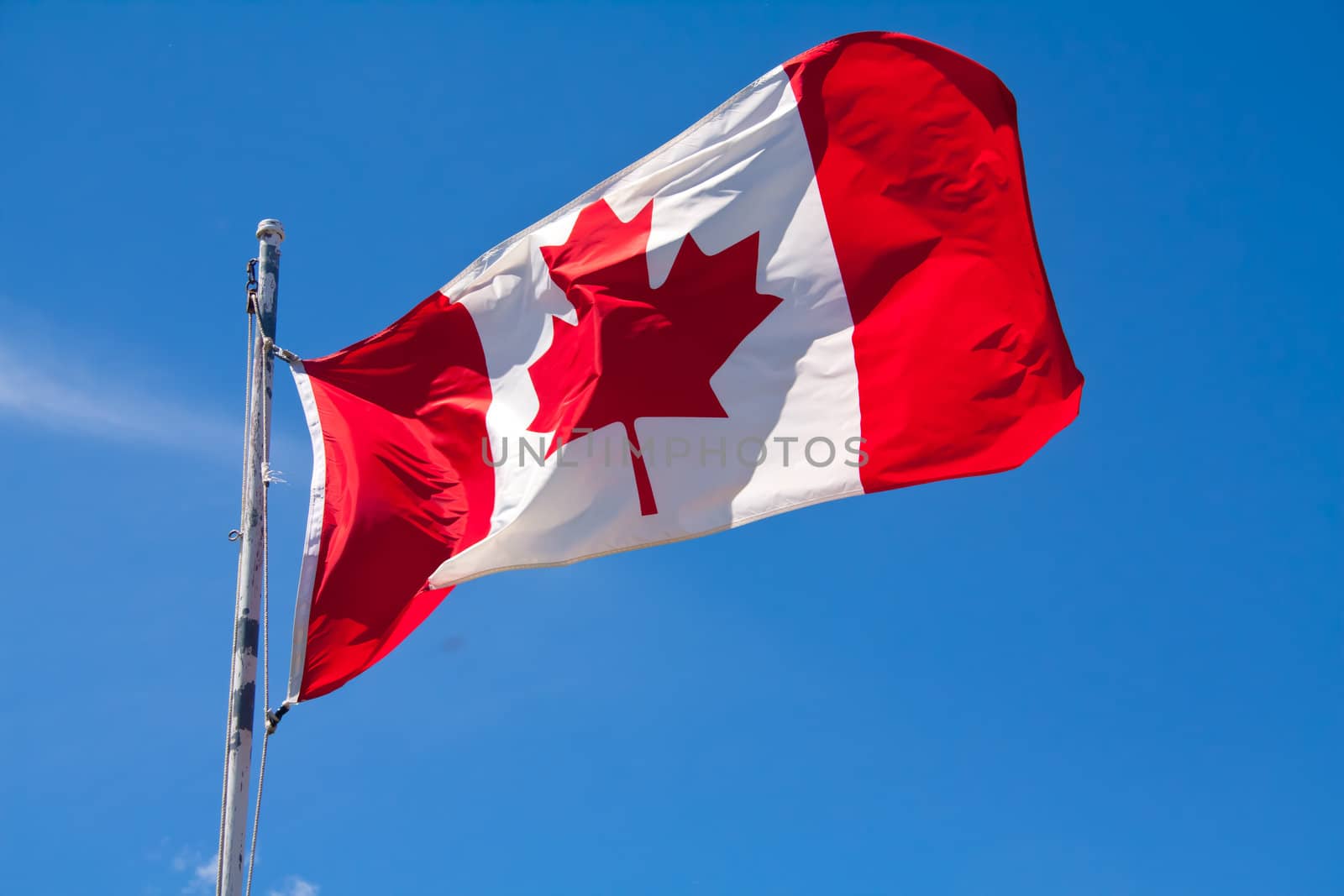 a Canadian Flag flapping in the breeze