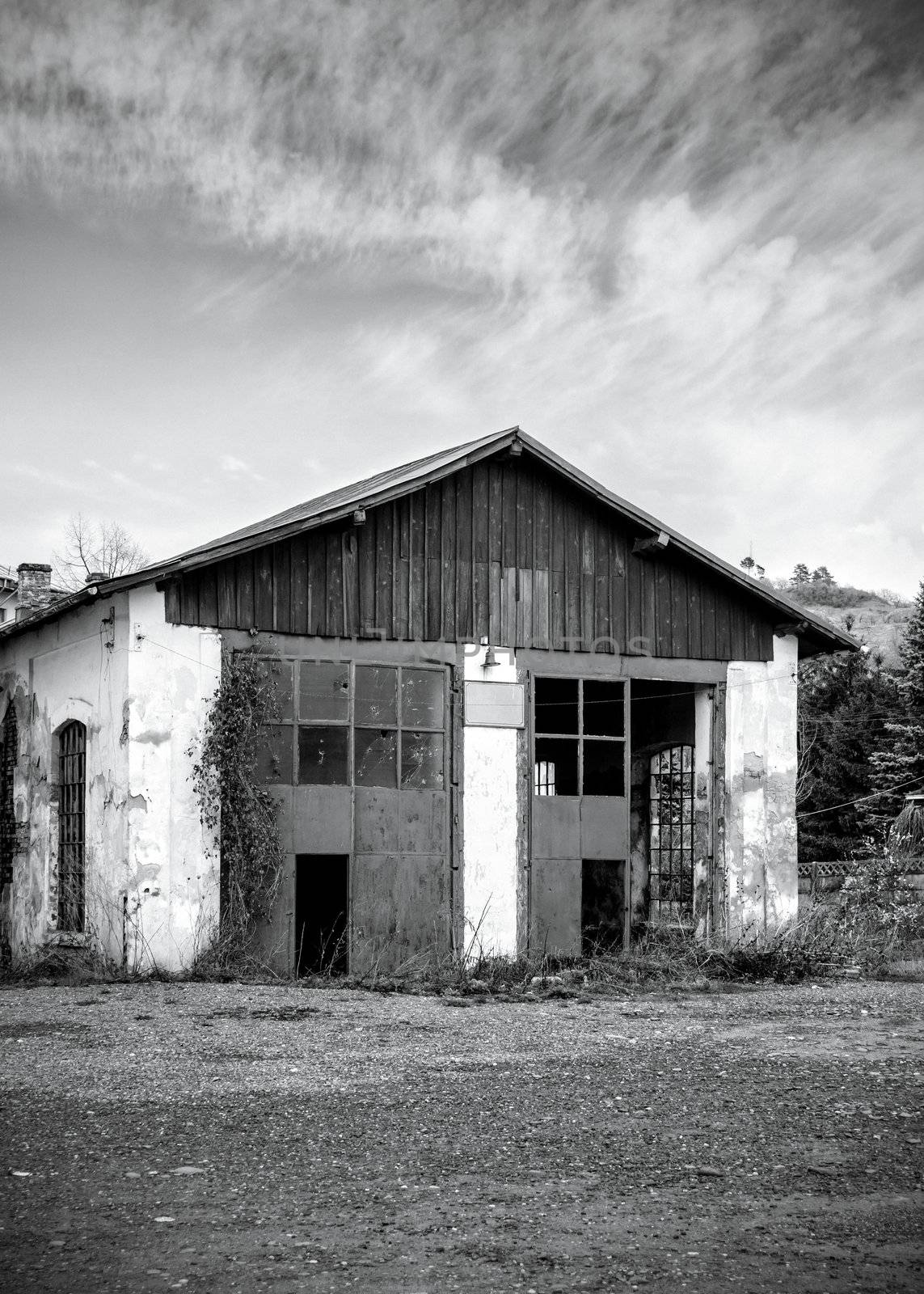 Black and white image of  abandoned warehouse