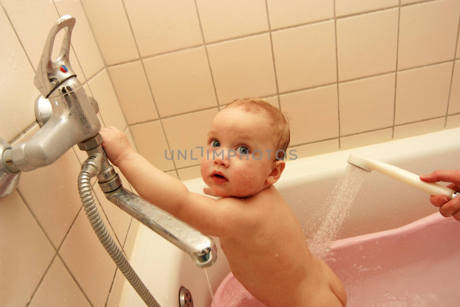 The little child taking a bath