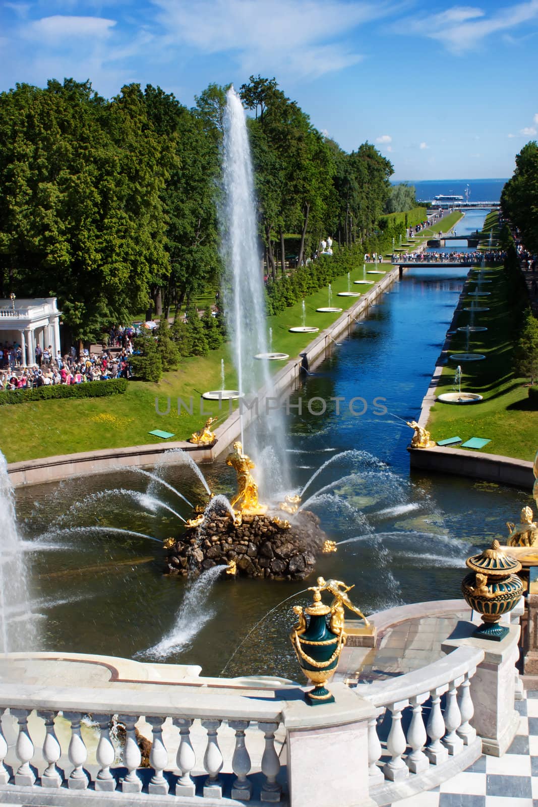 Canal with fountain and golden statues in lower park of Peterhof. Russia, St.Petersburg.