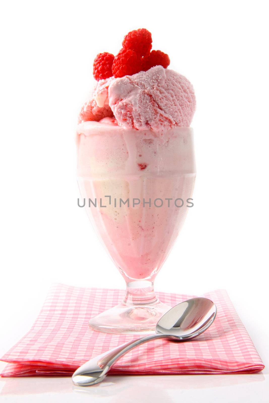 Raspberry sundae with napkin on white  by Sandralise
