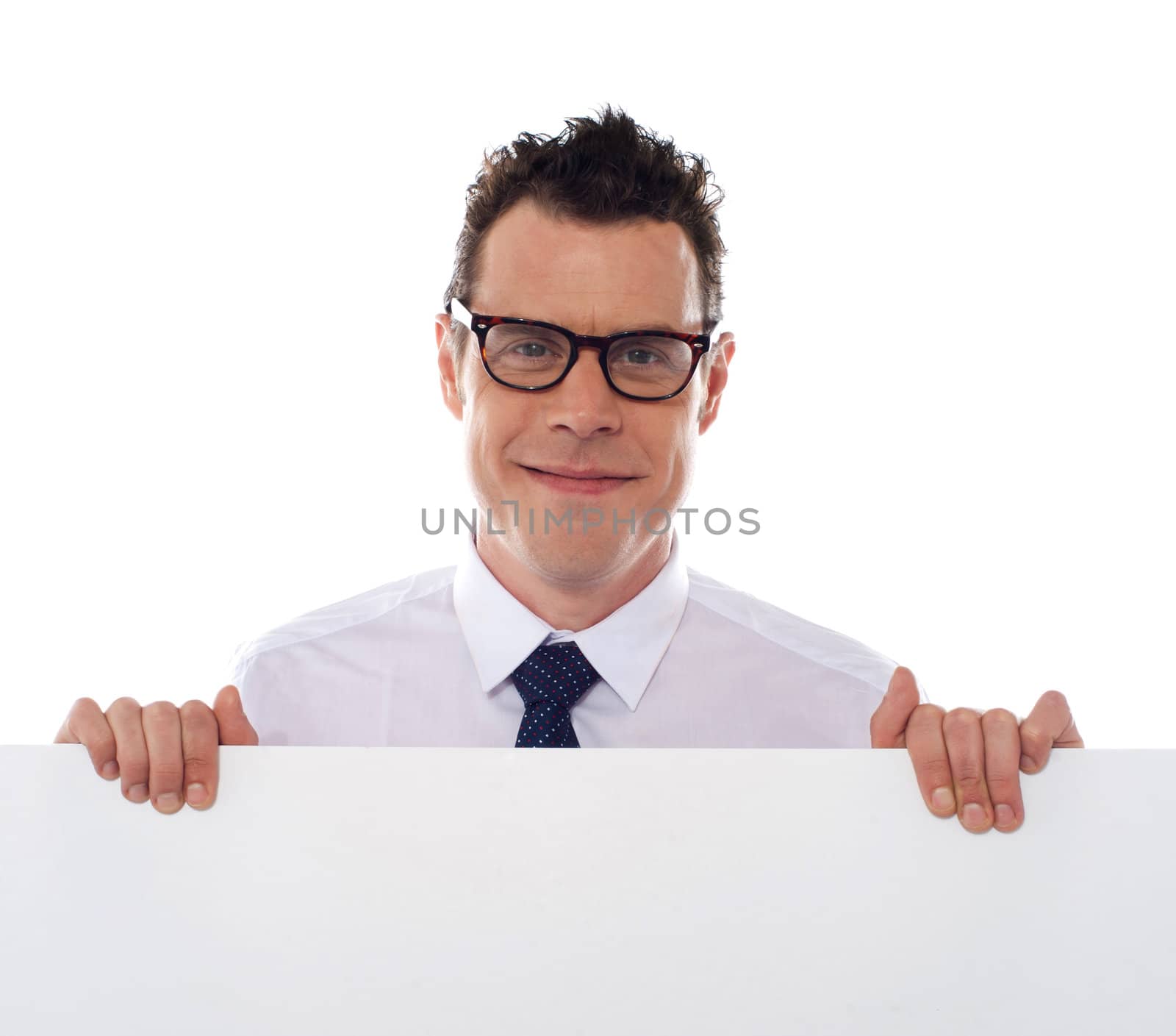 Young man holding blank billboard wearing eyeglasses. Closeup shot