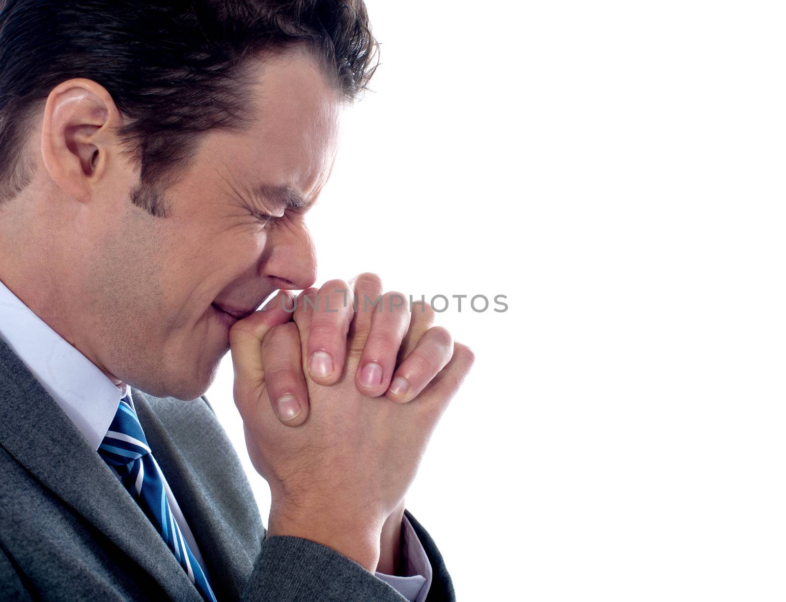 Business executive praying to god after business disappointment