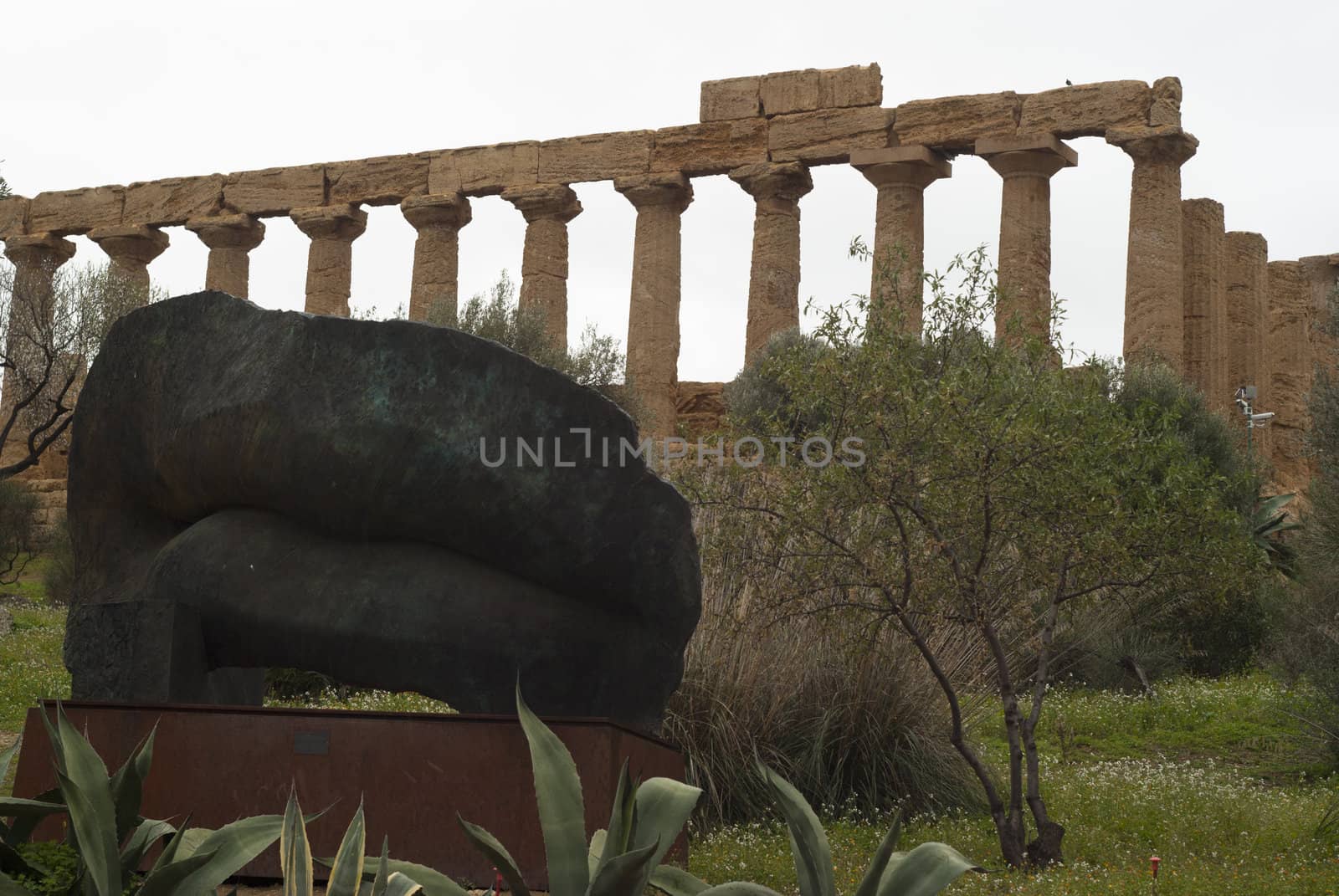 Statue and ruins in "Valle dei Templi"-  Valley of the temples, Agrigento, Sicily, Italy