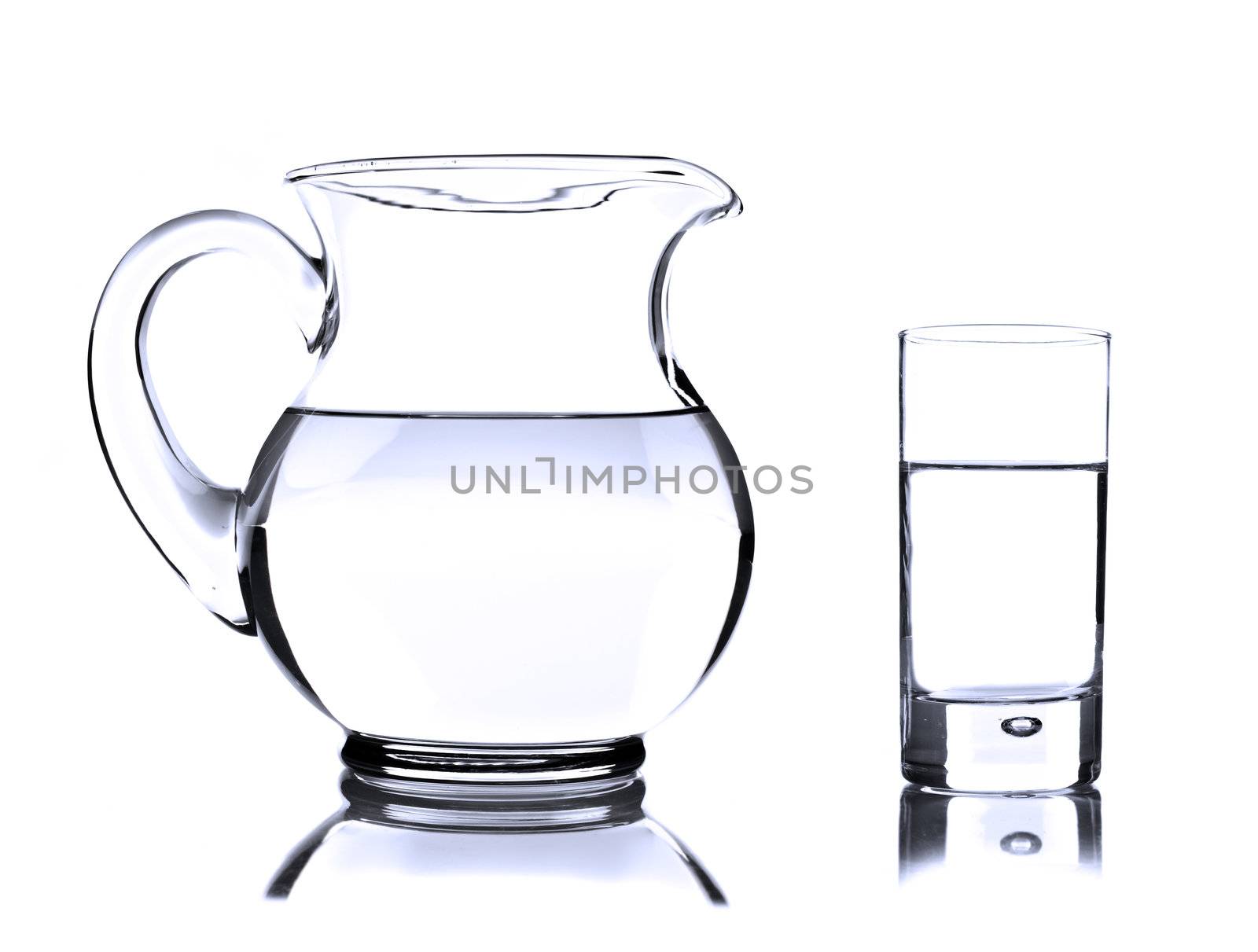 Glass jug and tumbler with water on white by tish1