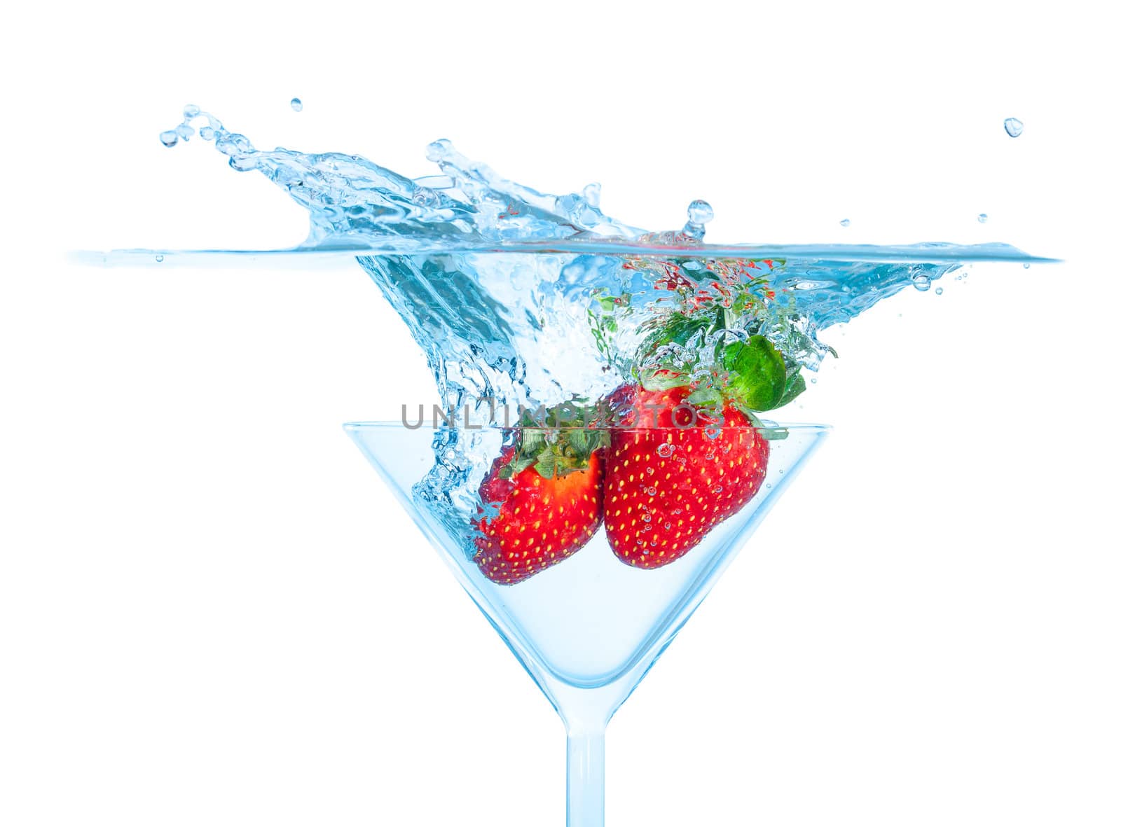 Fresh Strawberry Dropped into Glass with Splash on white backgrounds