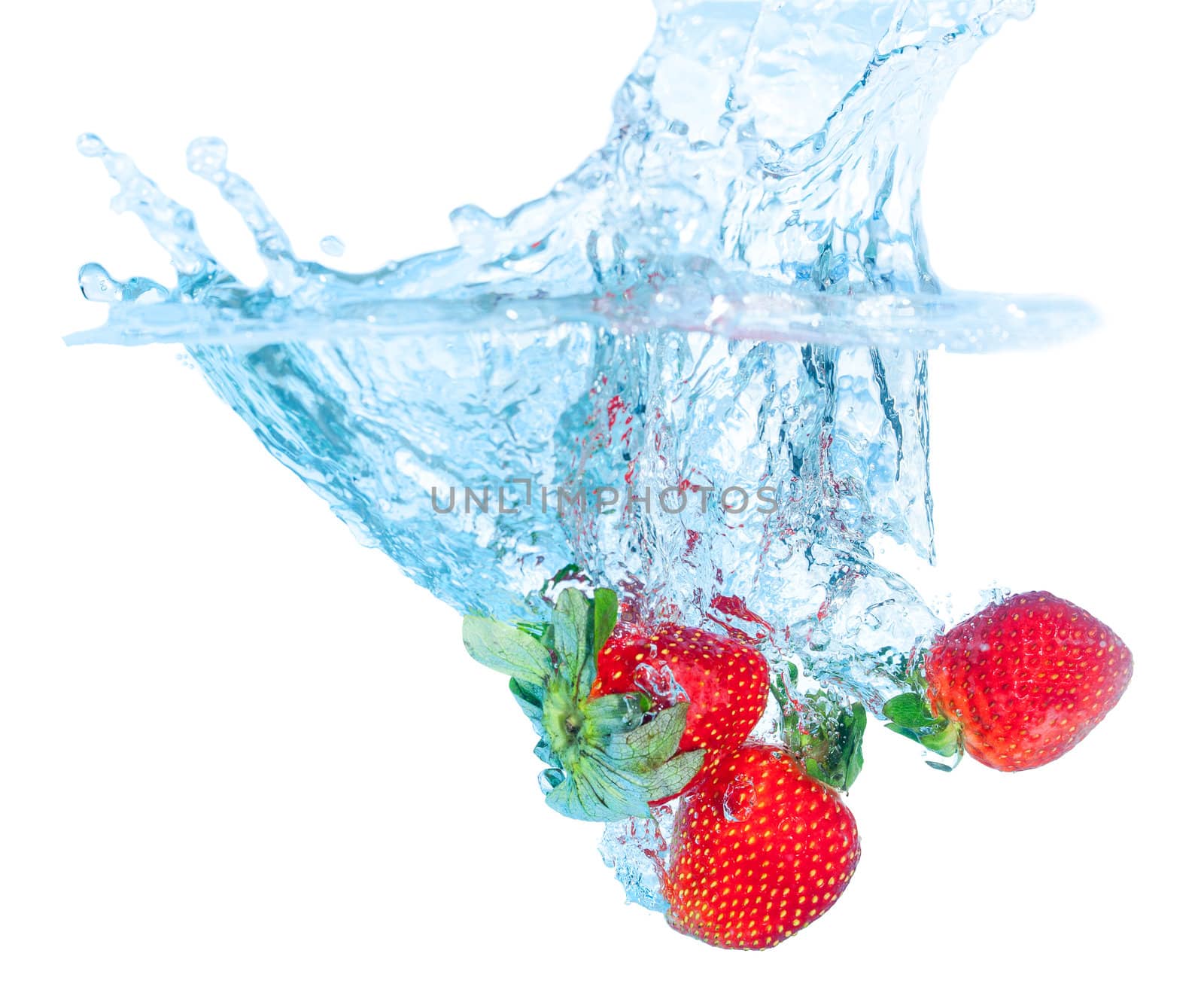 Fresh Strawberry Dropped into Water with Splash on white backgrounds