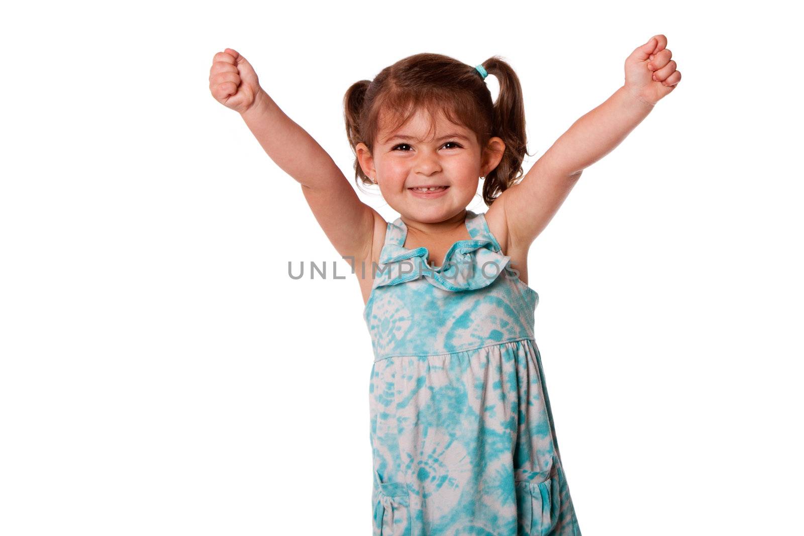 Cute beautiful funny happy little toddler girl celebrating with hand up in air, isolated.