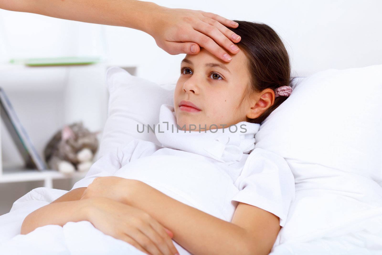 Little girl with illness at bed at home