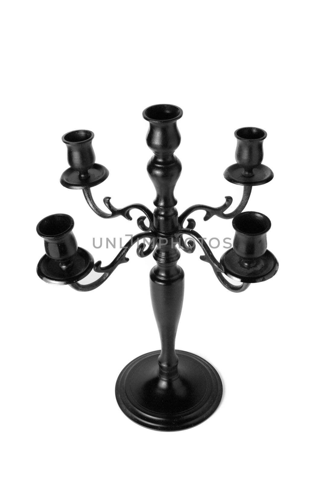 Tall black candle. On a white background.