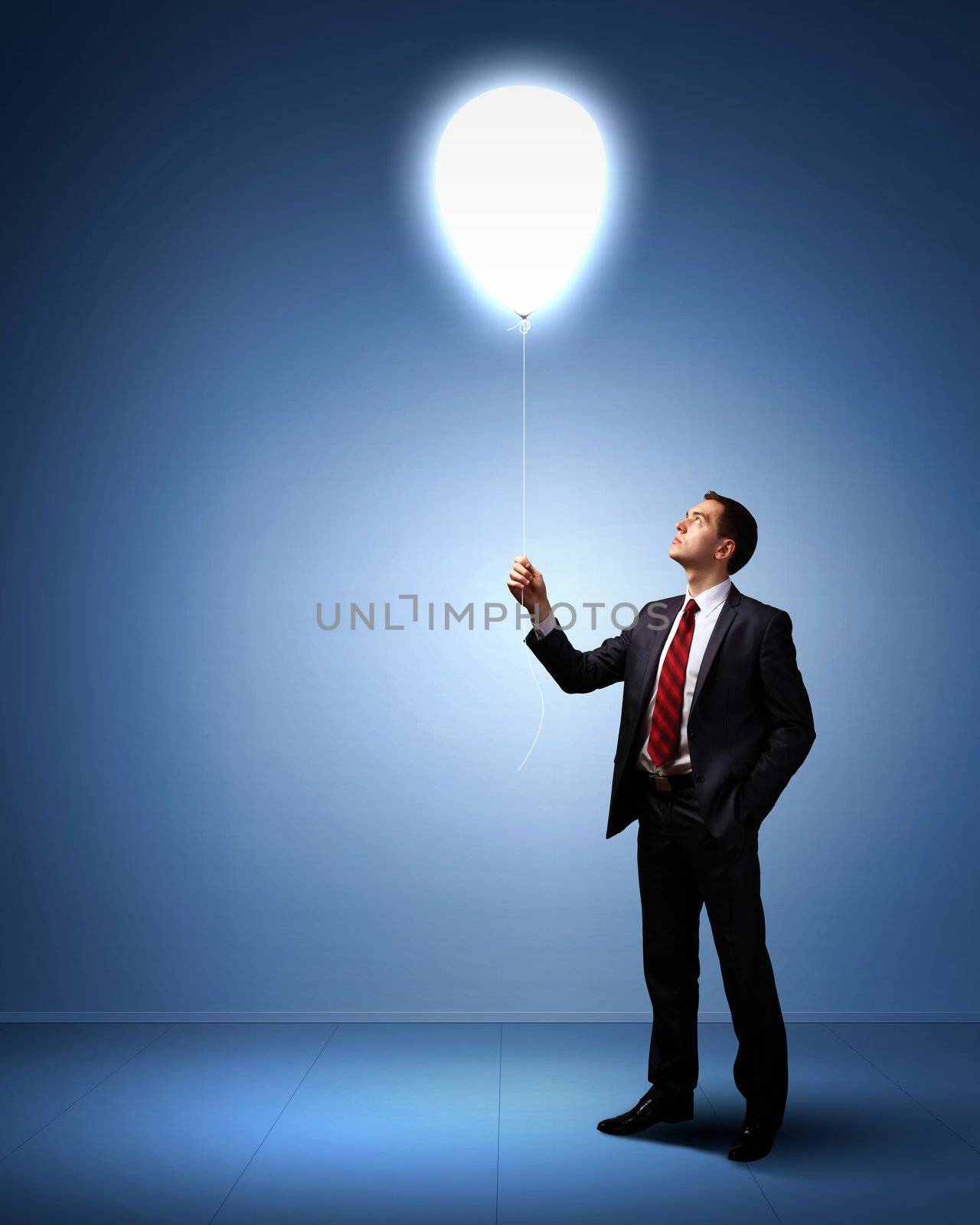 Light bulb and a business person as symbols of creativity in business