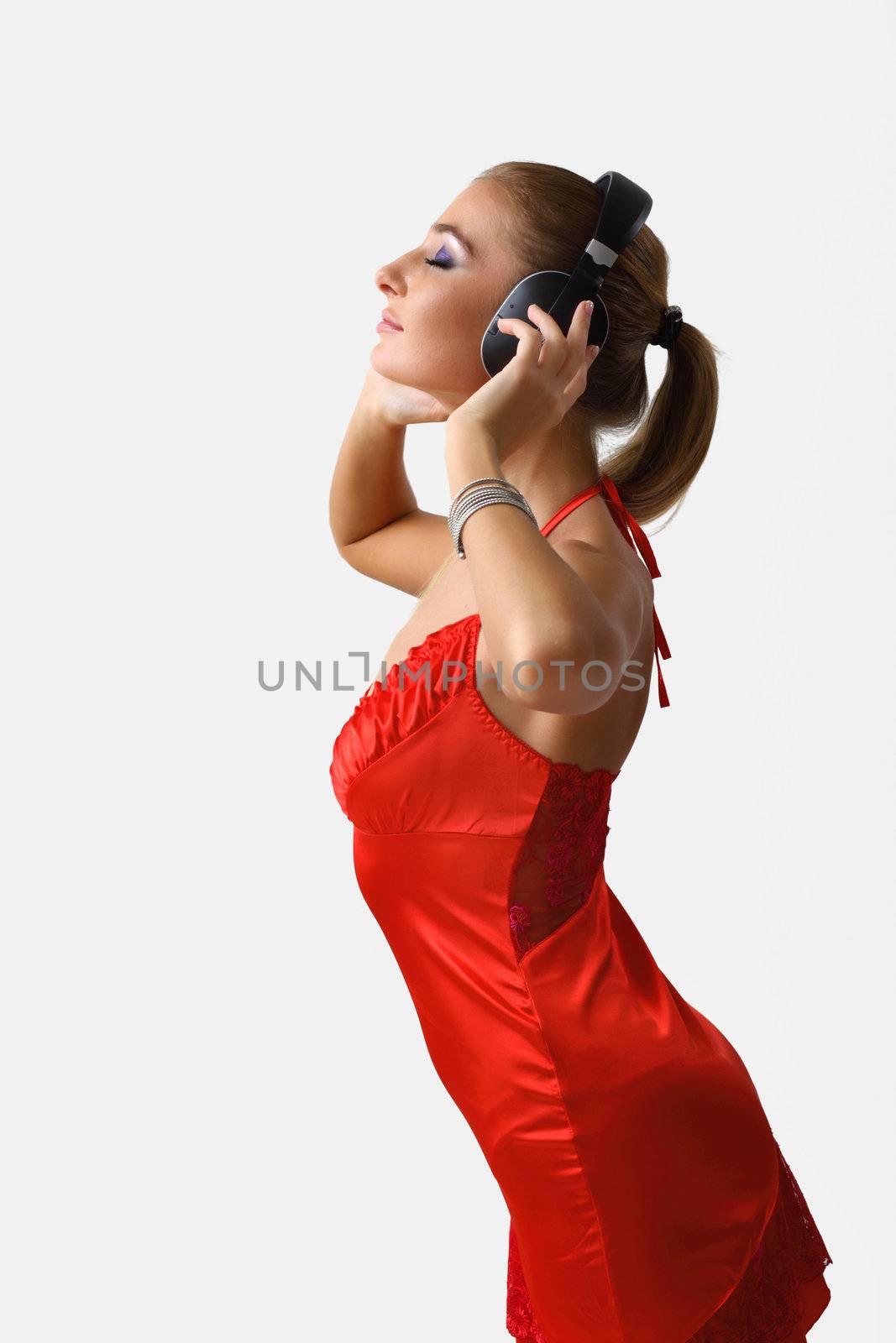 Portrait of young woman with headphones by sergey_nivens