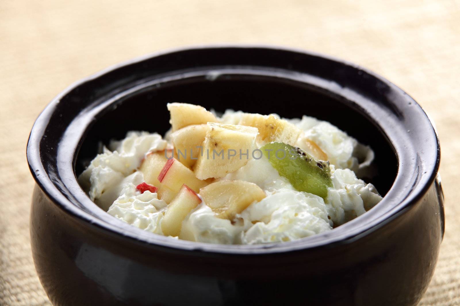 fresh icecream with fruits in black pan