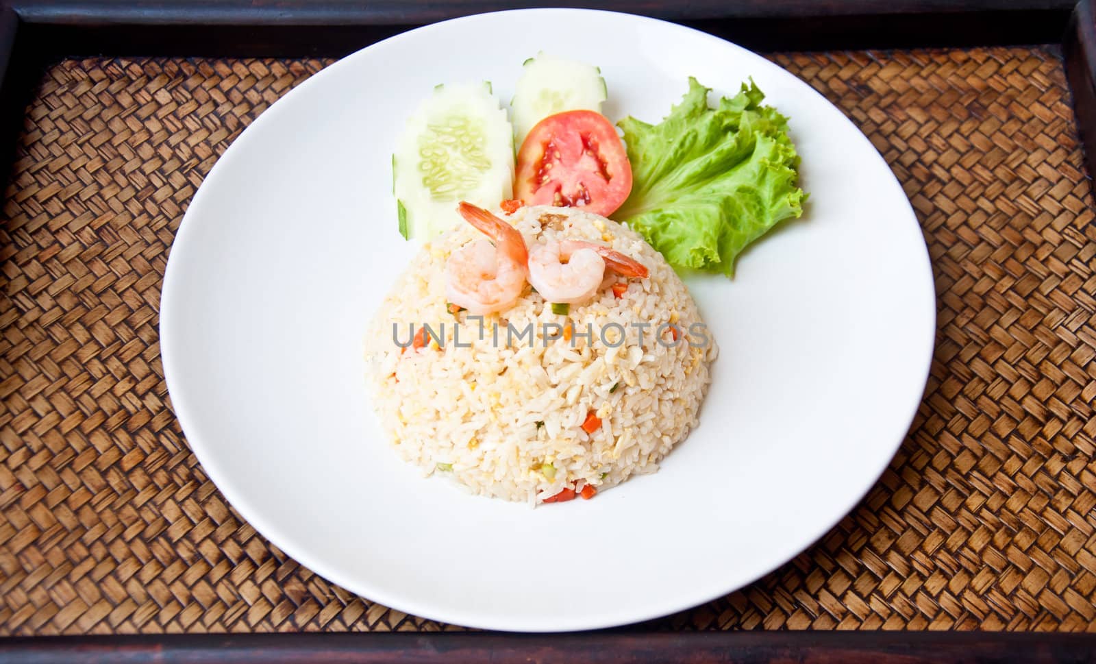 Fried rice with shrimp on sedge background