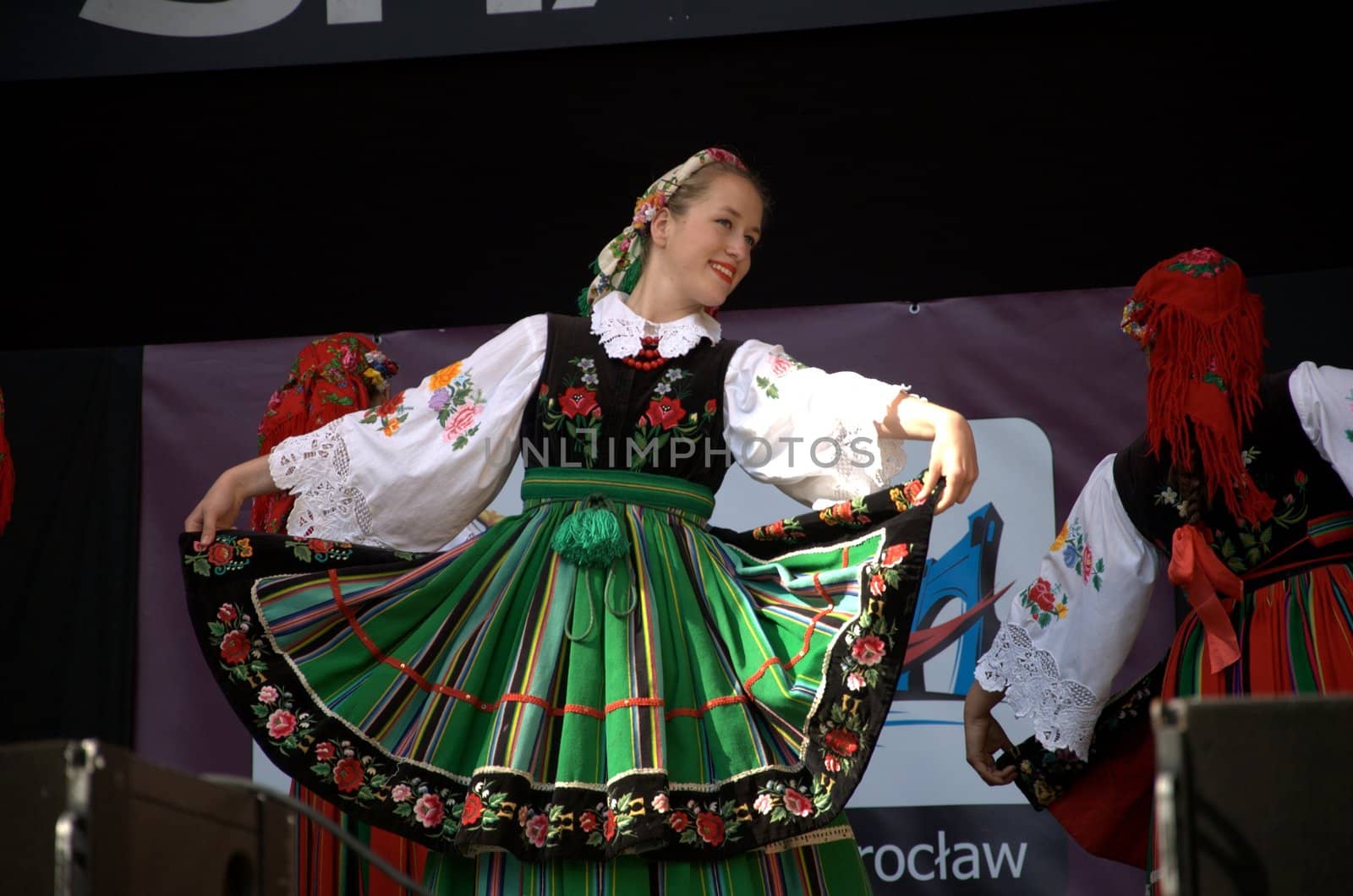 WROCLAW, POLAND - JUNE 15:  Members of Folk Dance group "Wroclaw" perform on Euro 2012 fanzone stage on June 15, 2012 in Wroclaw.  