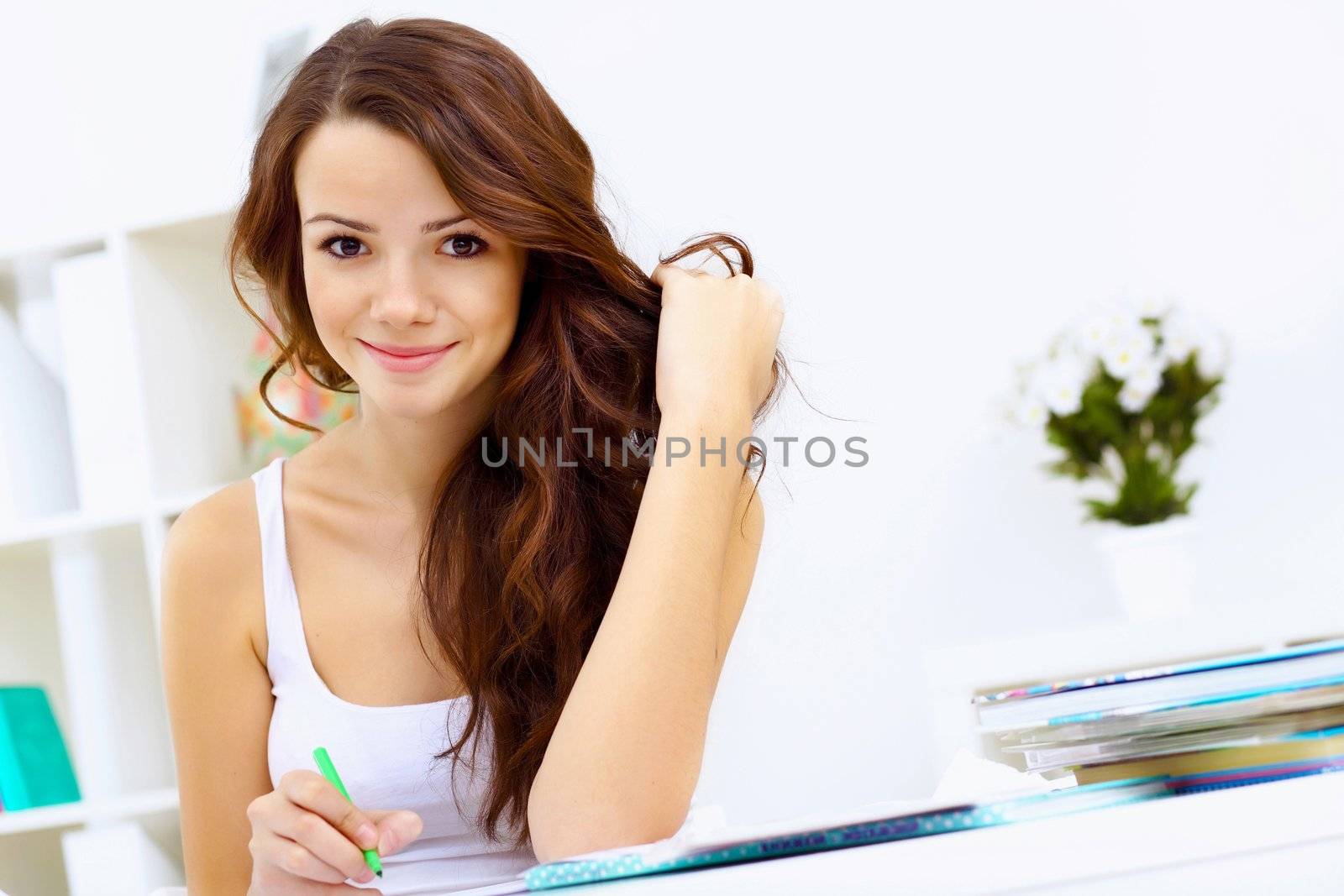 Student girl studying her lessons at home