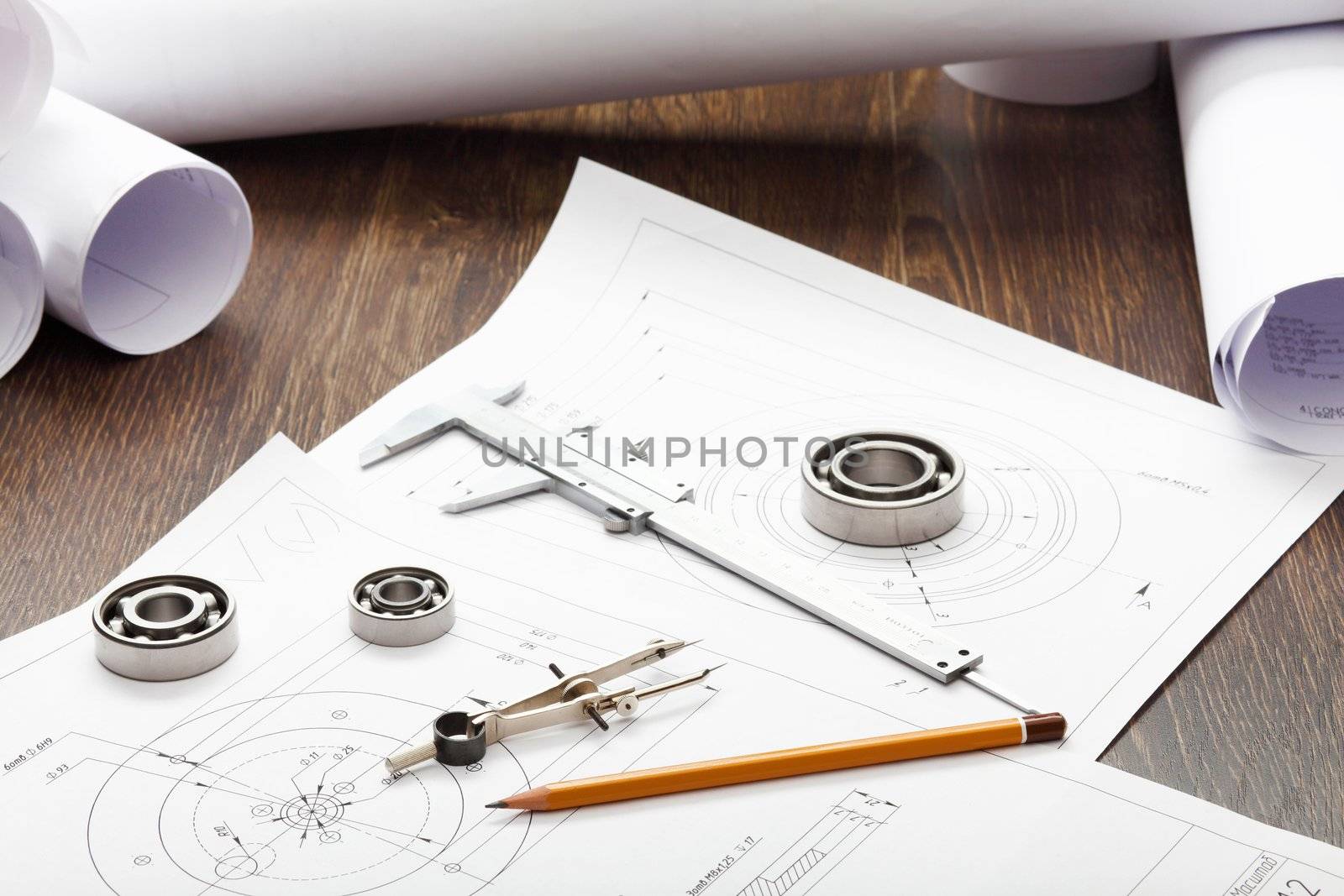 Tools and papers with sketches on the table