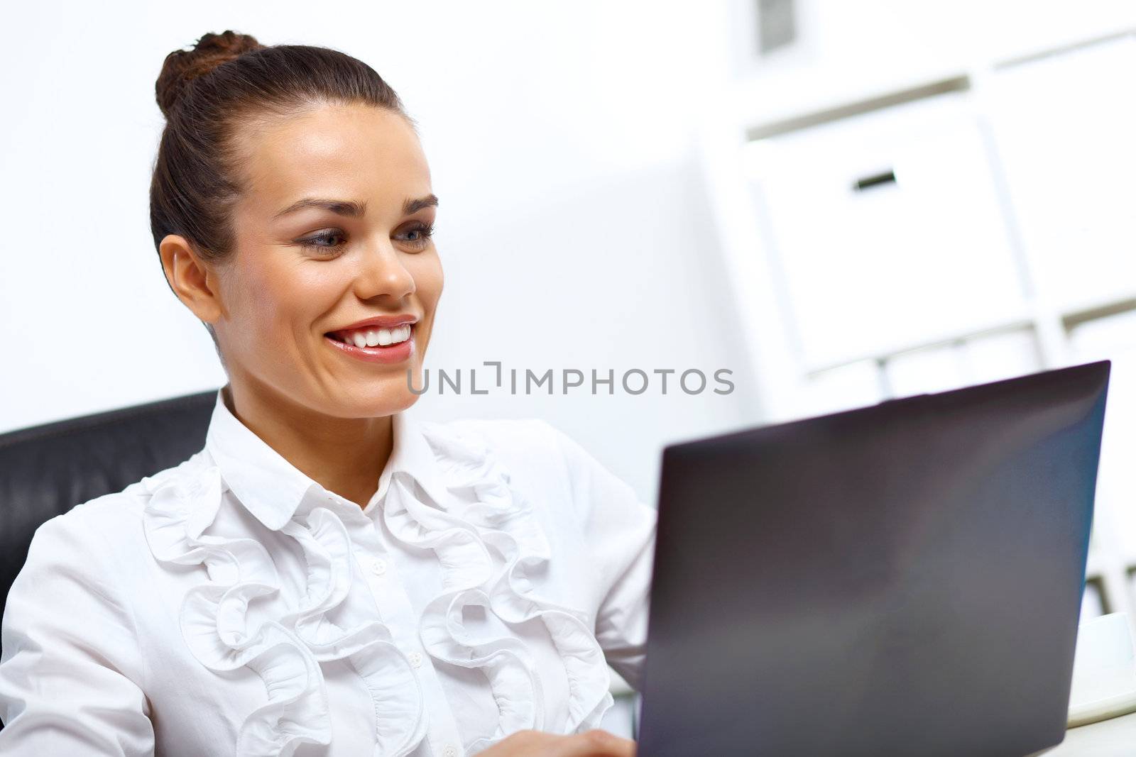 Young manager working with notebook in the office