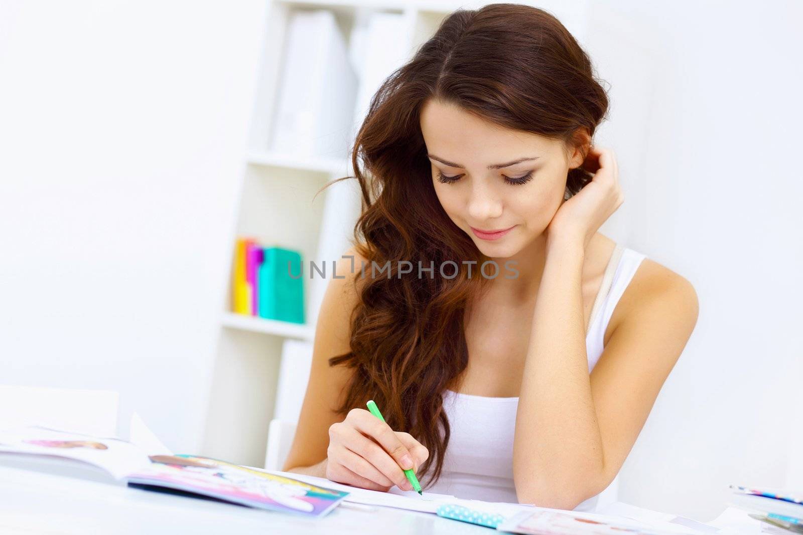 Student girl studying her lessons at home