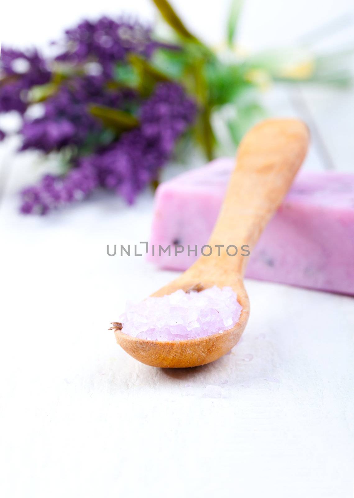 Lavender bath salt on wooden spoon by motorolka