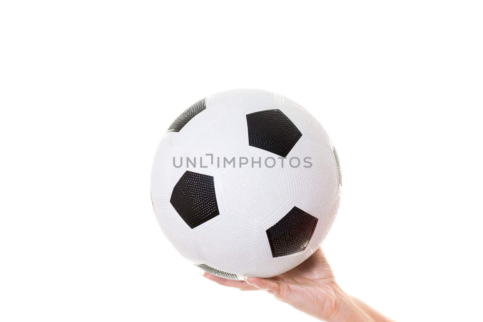 womans hand holding soccer ball isolated on white