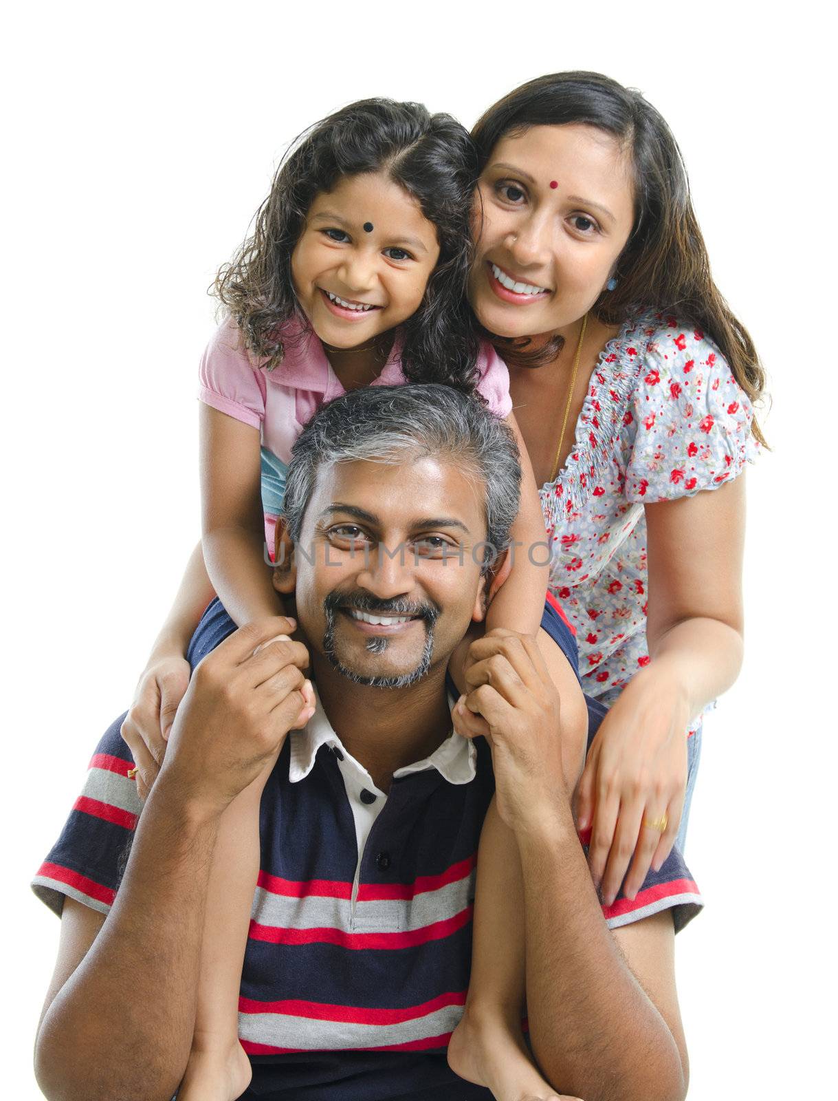 Happy Asian Indian family stacking on white background