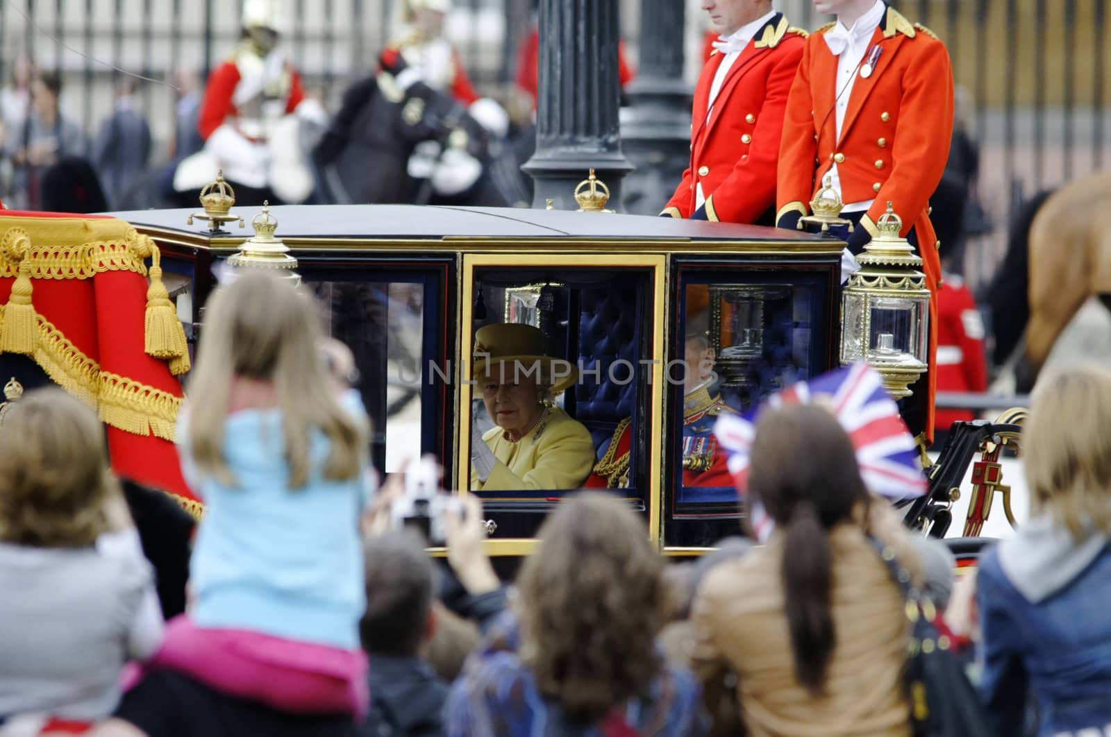 LONDON, UK - June 16: Queen Elizabeth II and the Duke of Edinburgh during Trooping the Colour ceremony on the Mall and at Buckingham Palace, on June 16, 2012 in London. Trooping the Colour takes place every year in June to officialy celebrate the sovereign birthday.