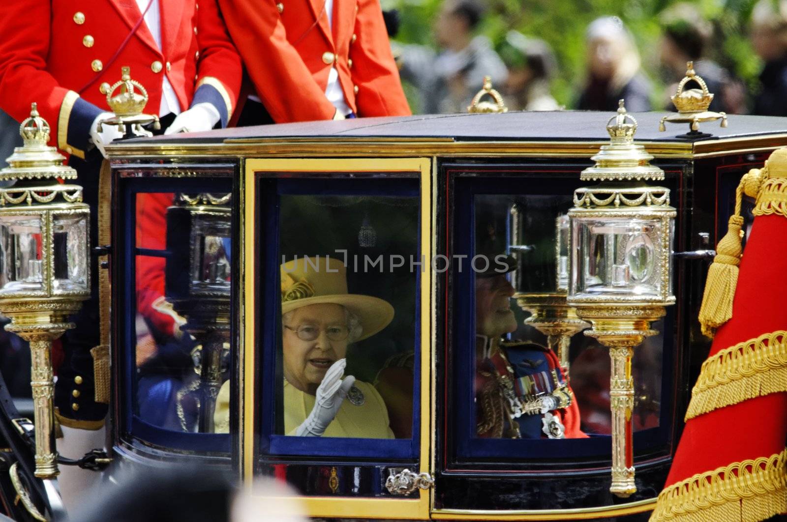 LONDON, UK - June 16: Queen Elizabeth II and the Duke of Edinburgh during Trooping the Colour ceremony on the Mall and at Buckingham Palace, on June 16, 2012 in London. Trooping the Colour takes place every year in June to officialy celebrate the sovereign birthday.