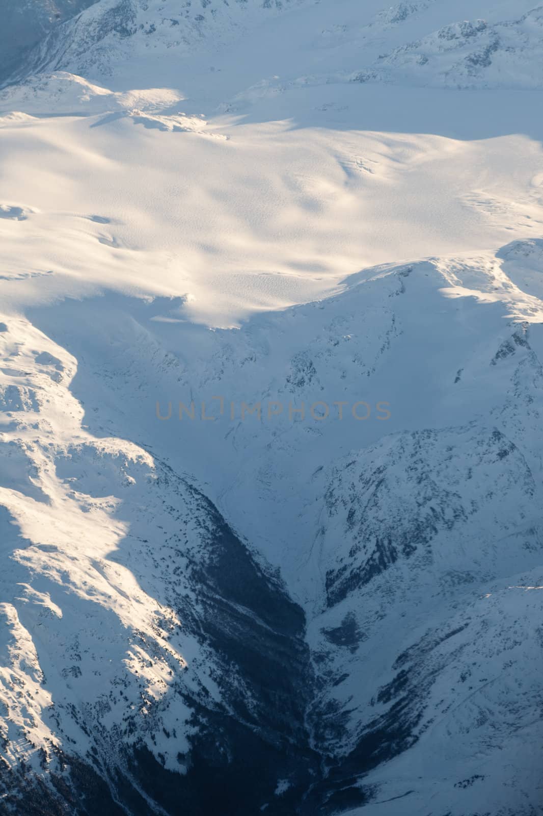 Aerial view of snowcapped peaks in BC, Canada by PiLens