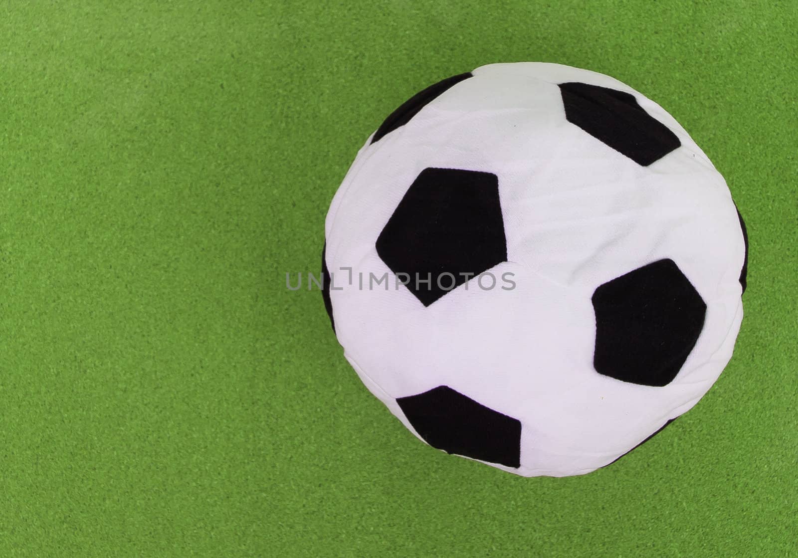 soccer ball with green cork board