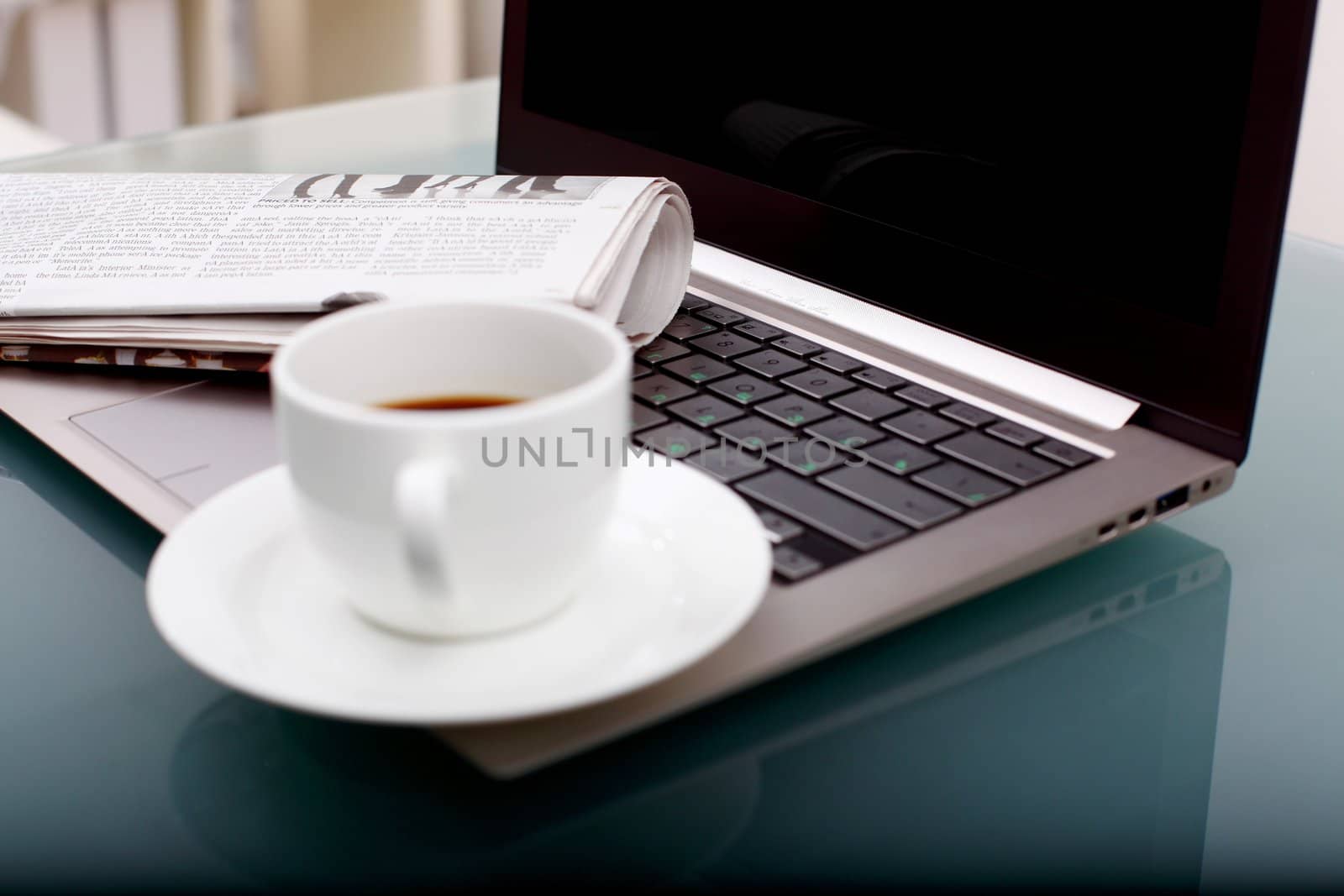 Image of business table with a cup of coffee and norebook
