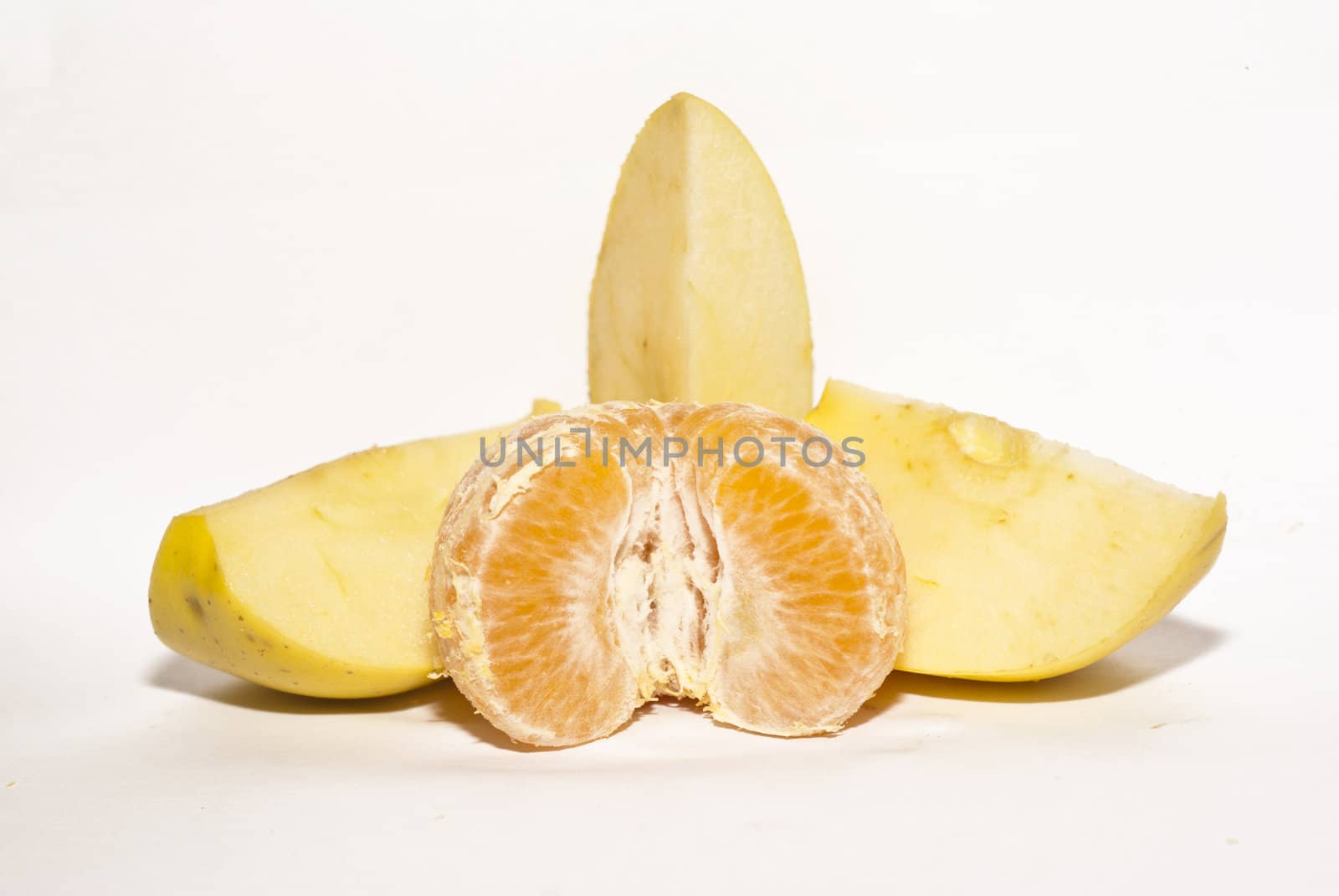 slices of apple and peeled tangerine