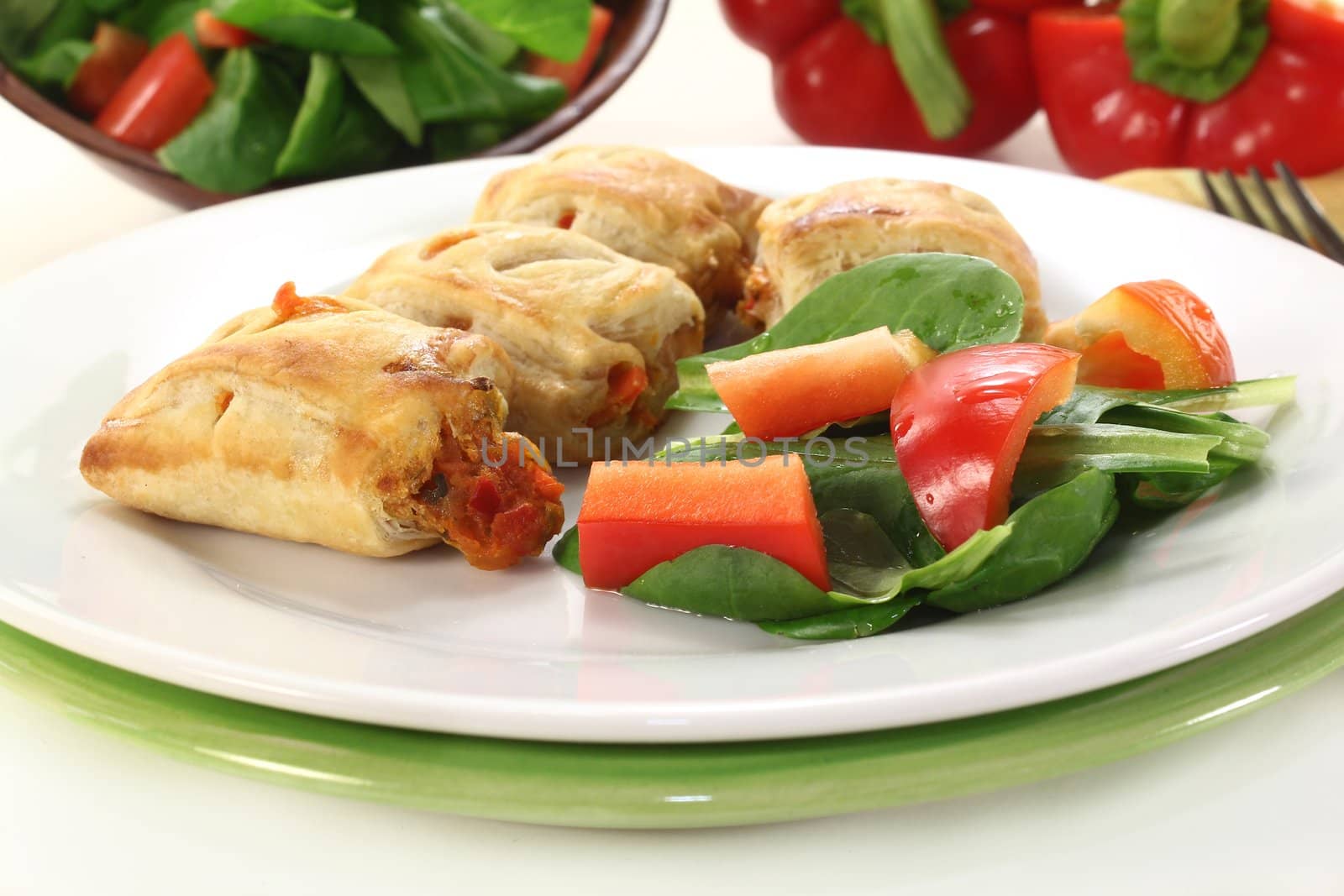 savory pastry snacks filled with red pepper and vegetables