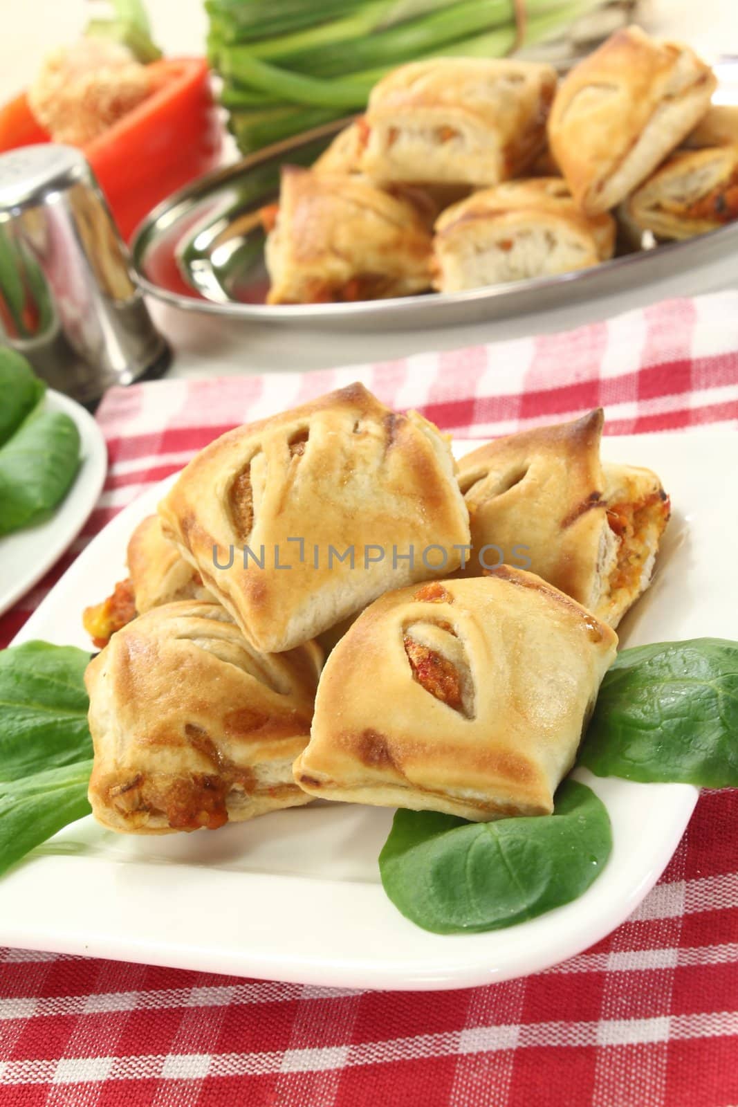 savory pastry snacks filled with red pepper and vegetables