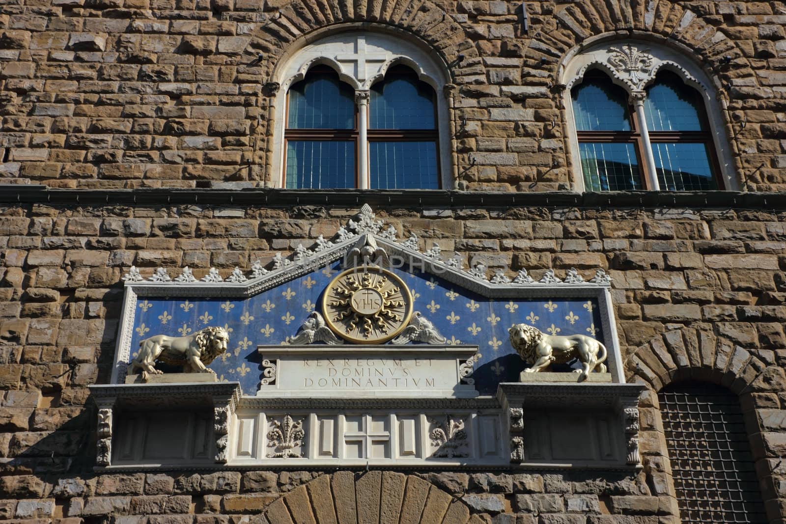 Palazzo Vecchio in Florence detail of facade - marble frontispiece above the entrance