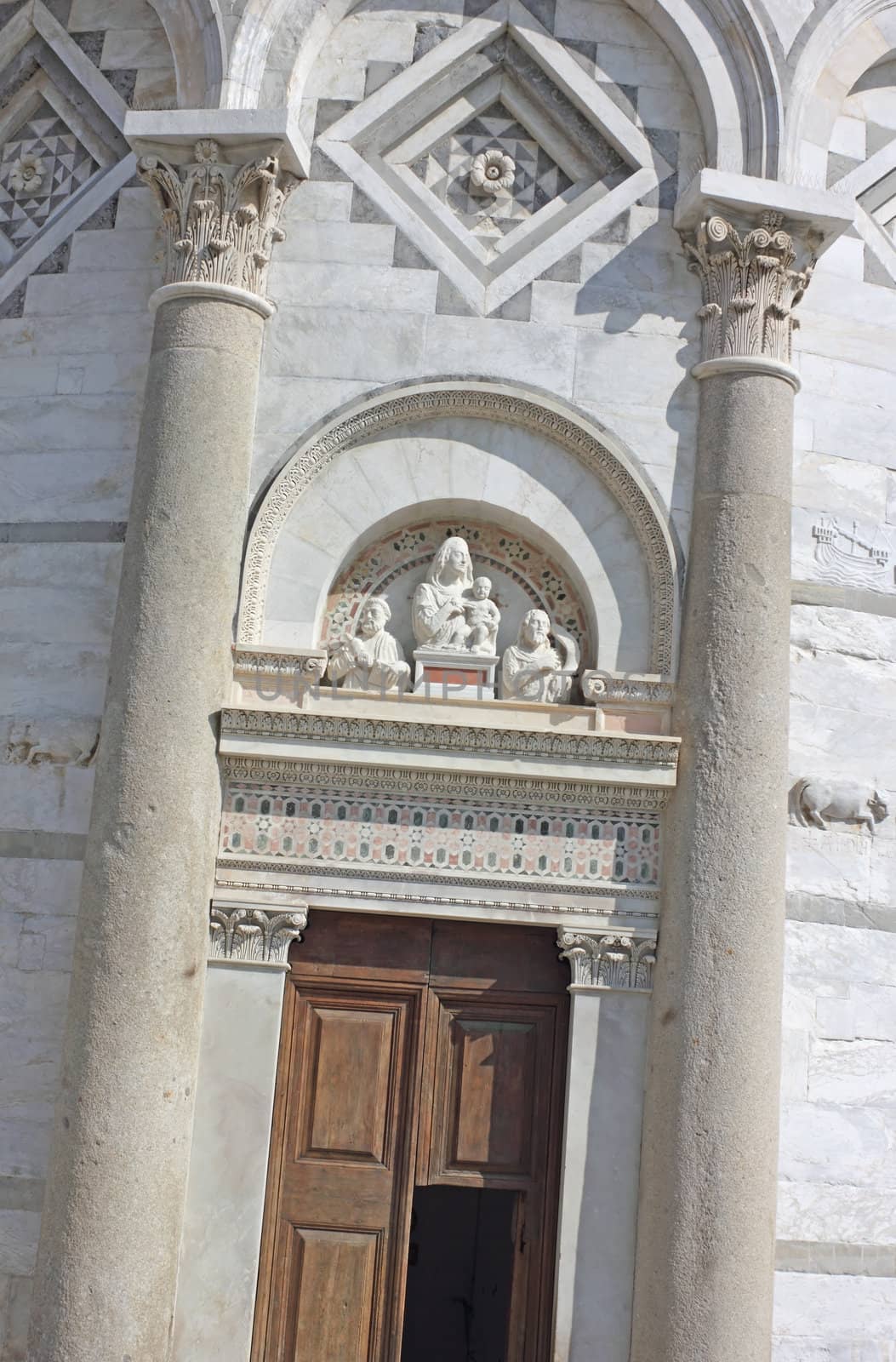 Straight shot of the leaning tower entrance door in Pisa, Italy