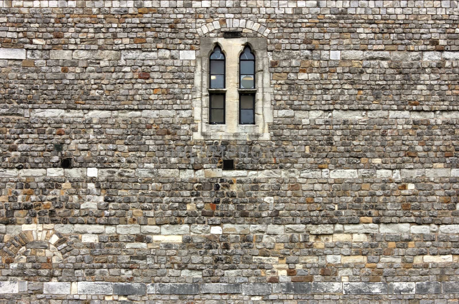 Detail with a single window from the castle wall in Windsor, Windsor Castle.