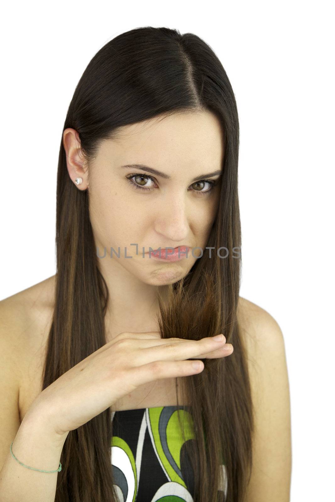 Young female model making funny face because of her split ends hair