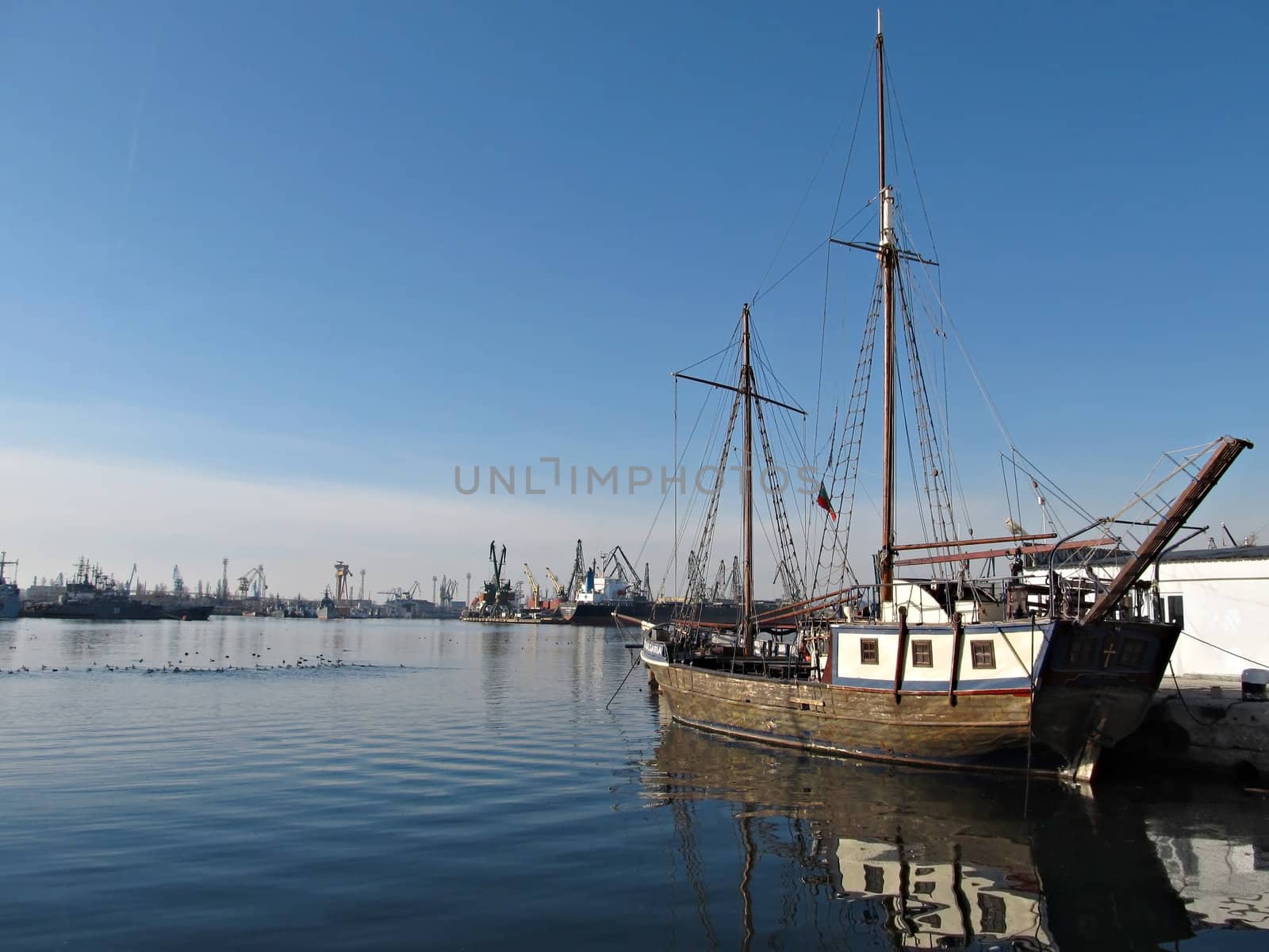 Old Ship Docked in the Calm Waters of big Harbor