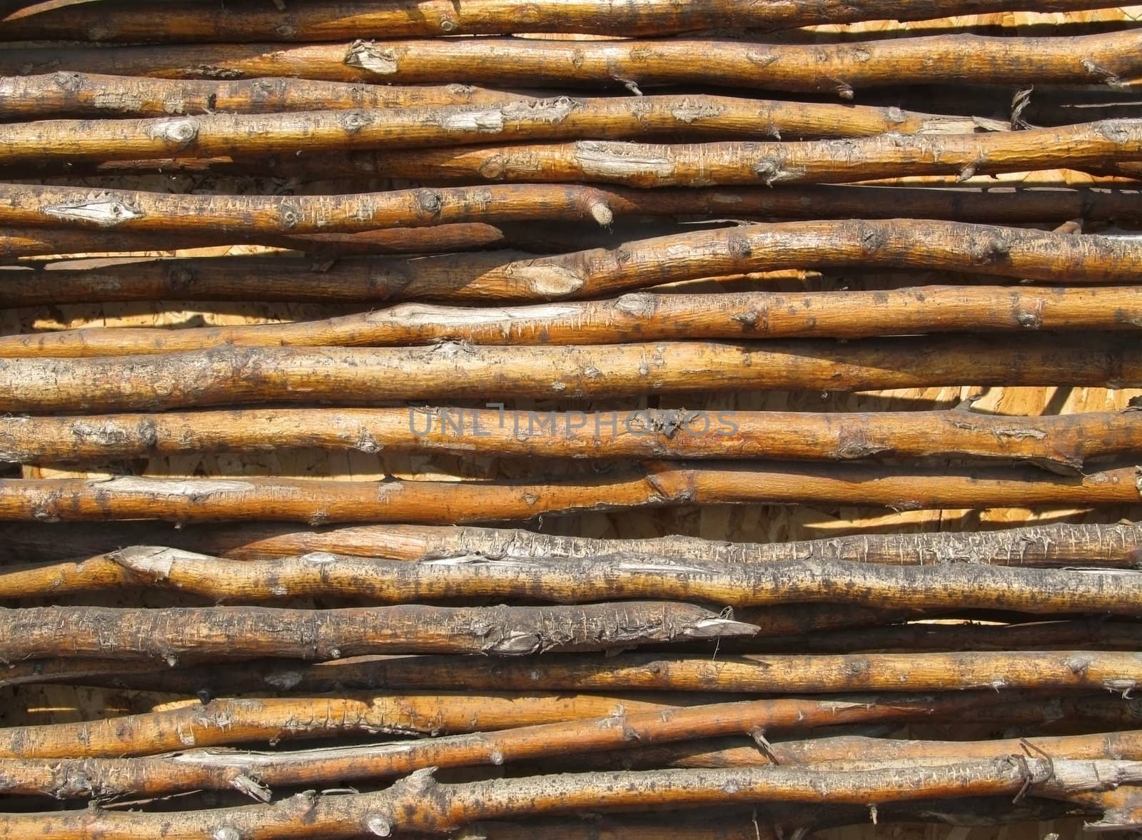 Background of an Old fence made from bended wooden sticks.