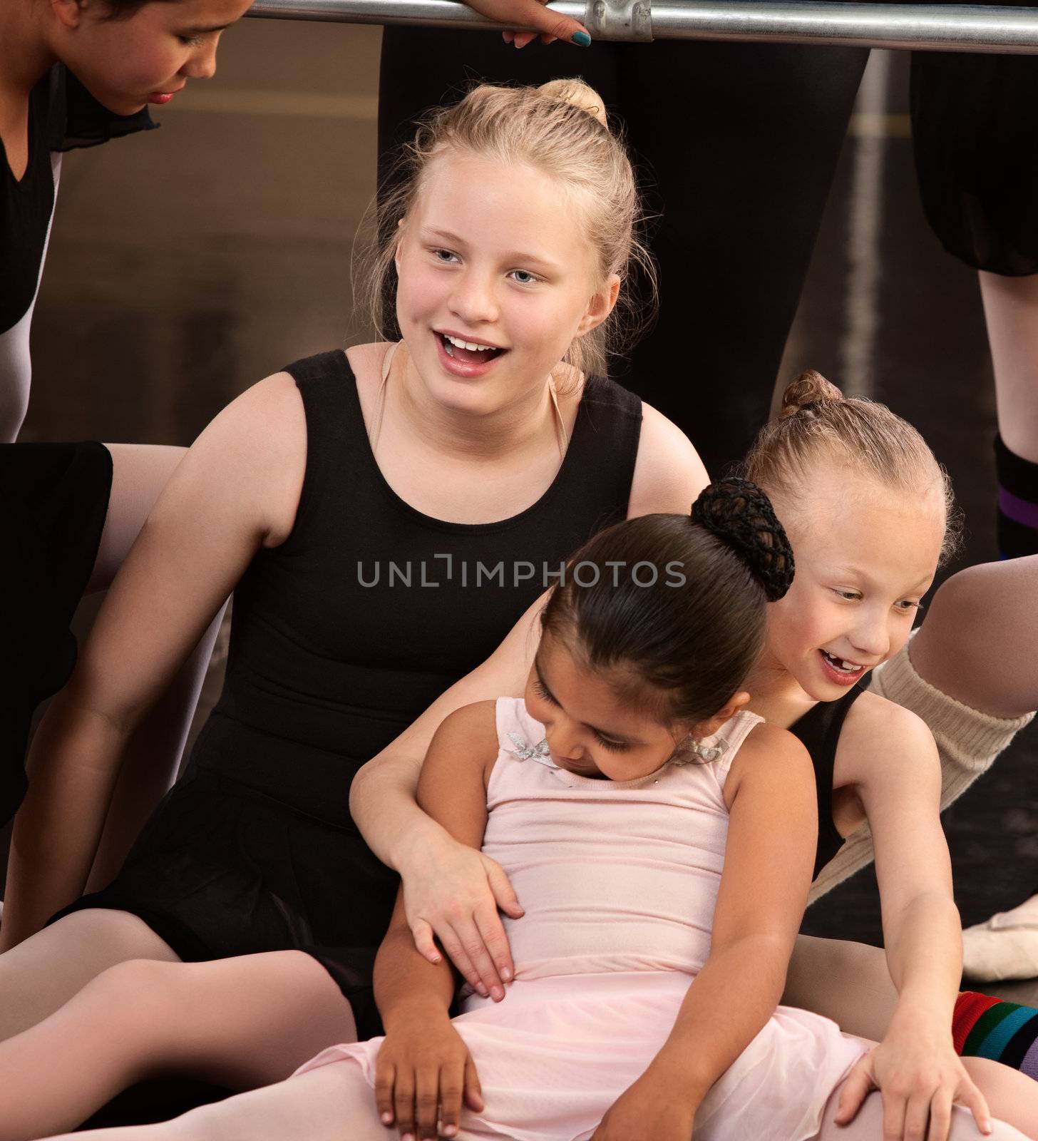 Group of ballet students goofing off in class