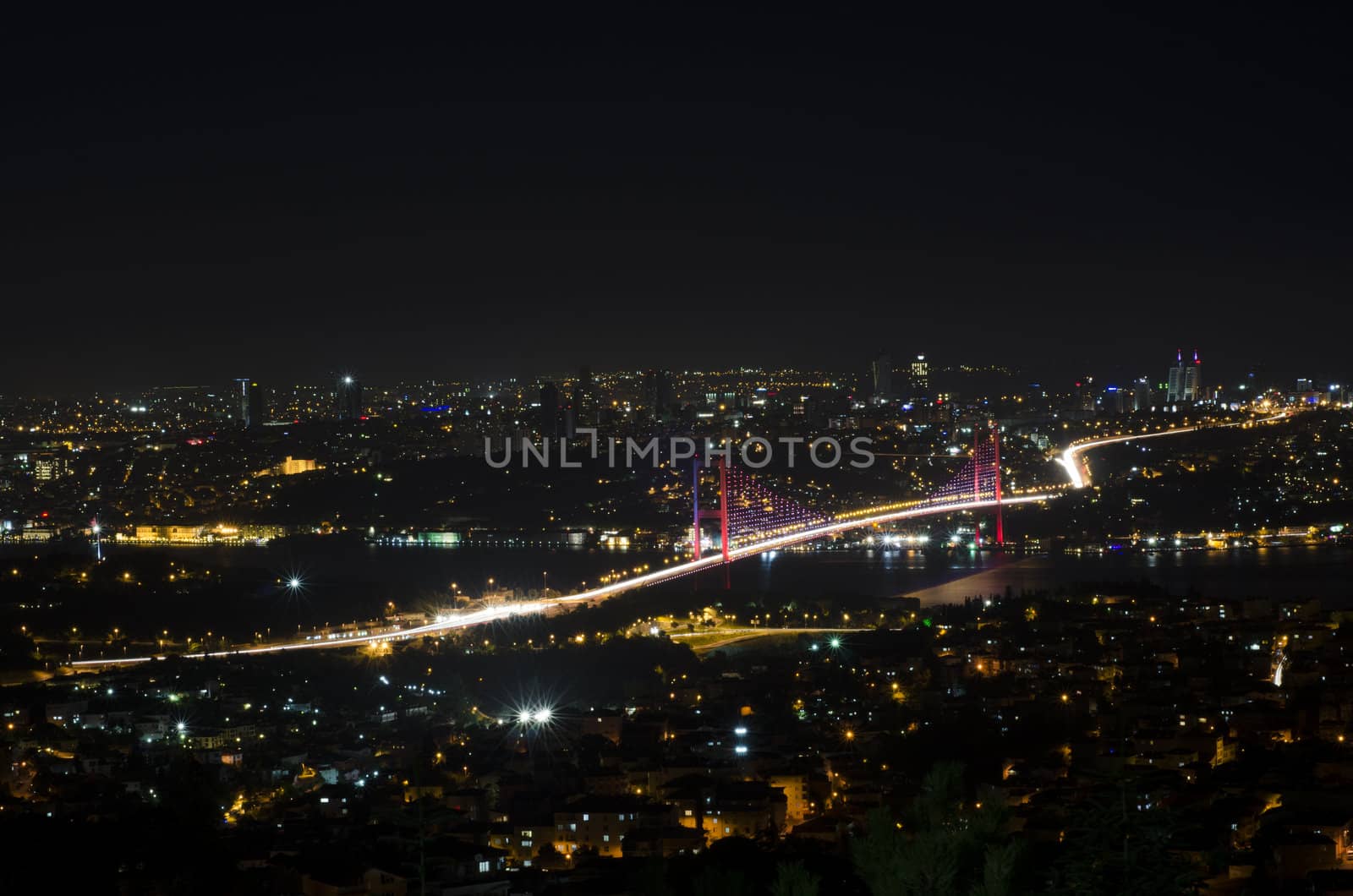 The night view of Bosphorus Bridge seem from camlıca illuminated by purple  led light in Istanbul