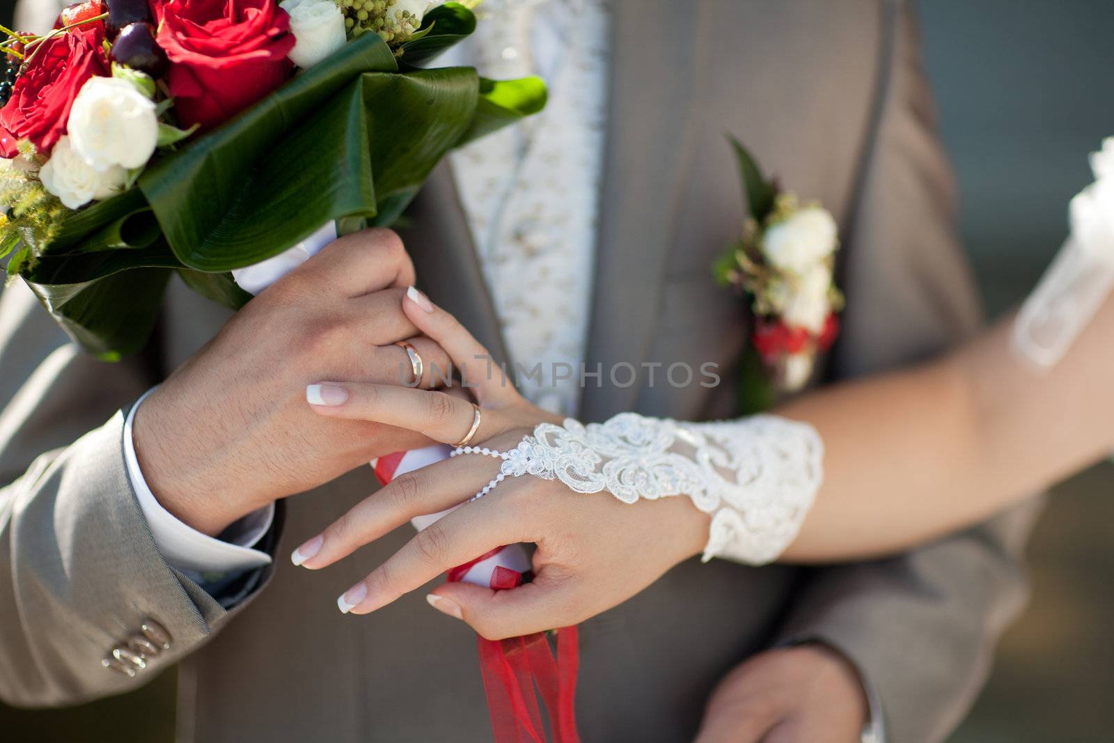 bouquet and wedding rings of bride and groom